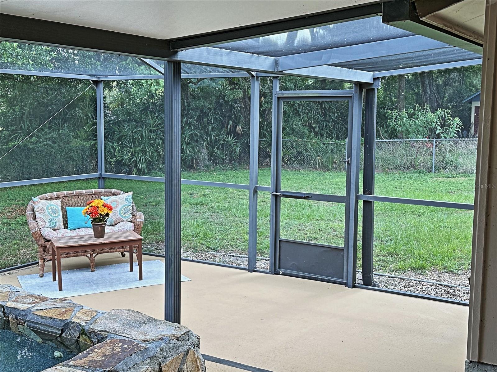 Part of the screened lanai is open air and another section has a roof.