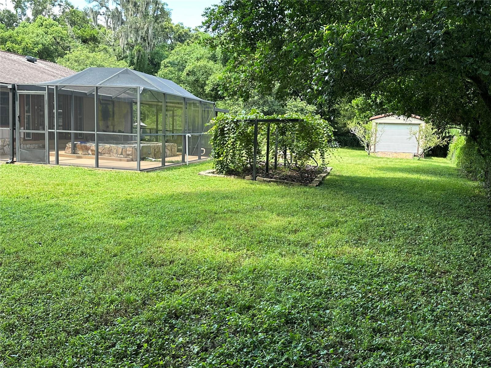 You can drive through the back yard to reach the storage work shop or to store four more trailers.