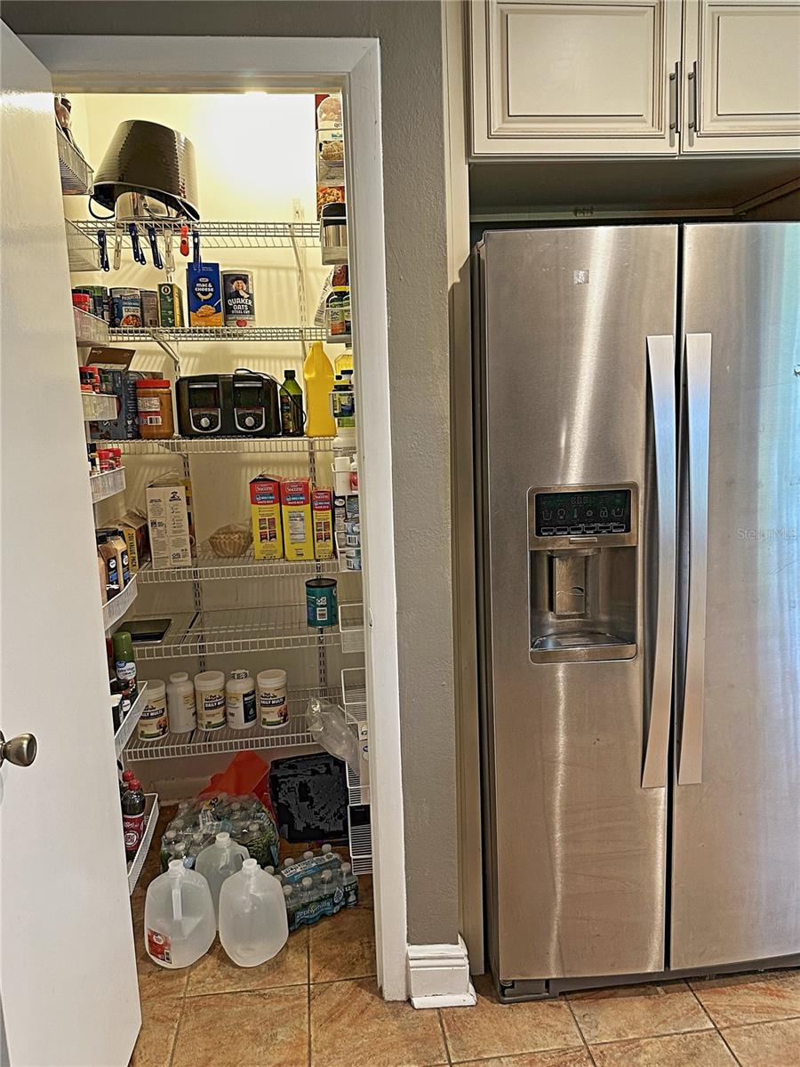 The large kitchen pantry is great for storage.