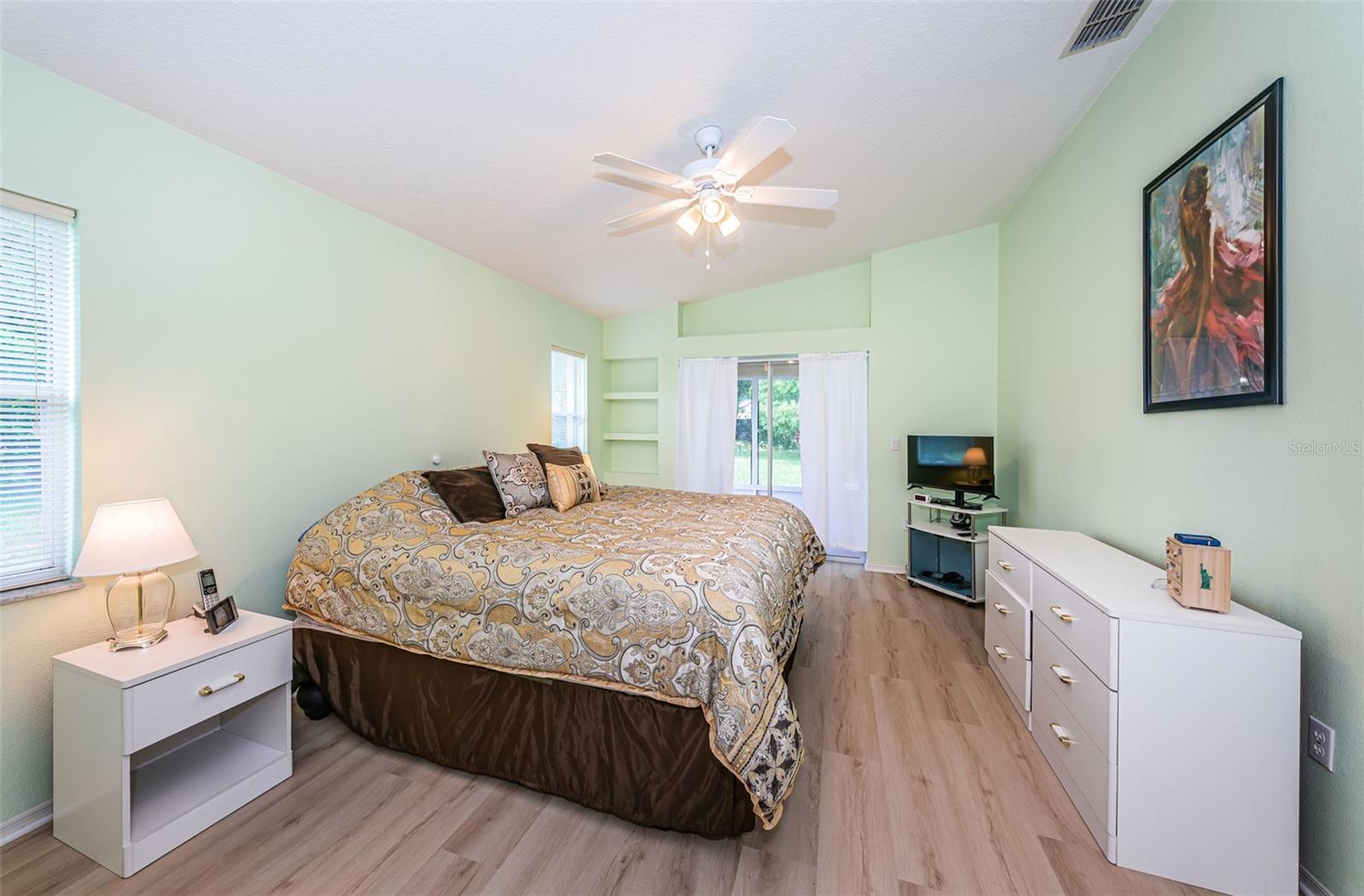 Primary bedroom, sliders to the enclosed lanai