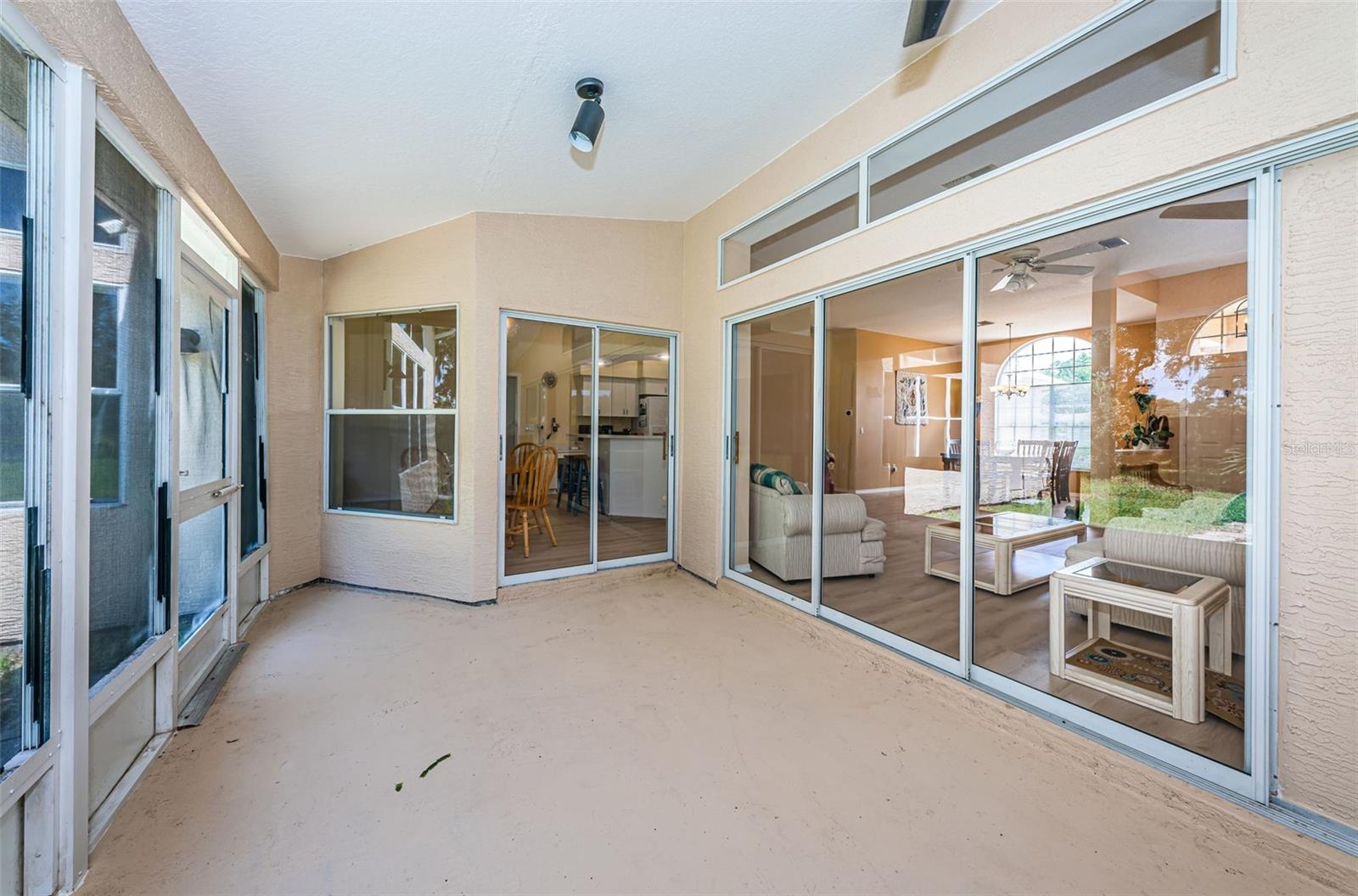 Outdoor screened in  lanai, pocketing sliders to the living room