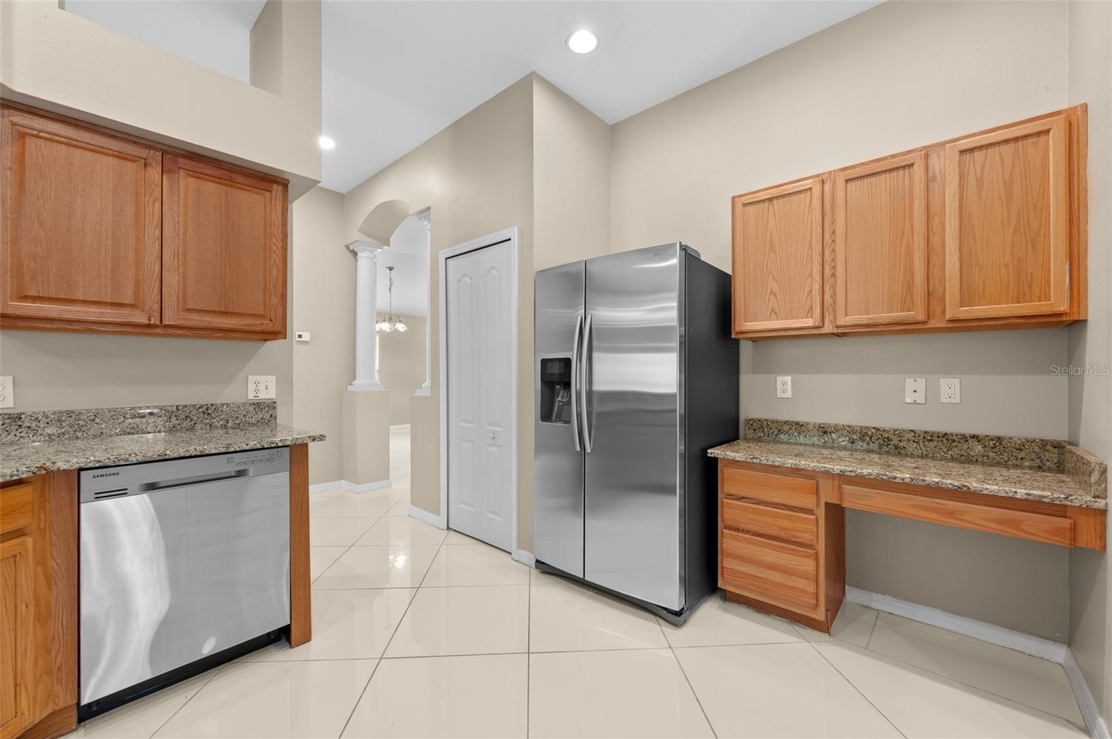 Desk area as well as Pantry closet in the kitchen