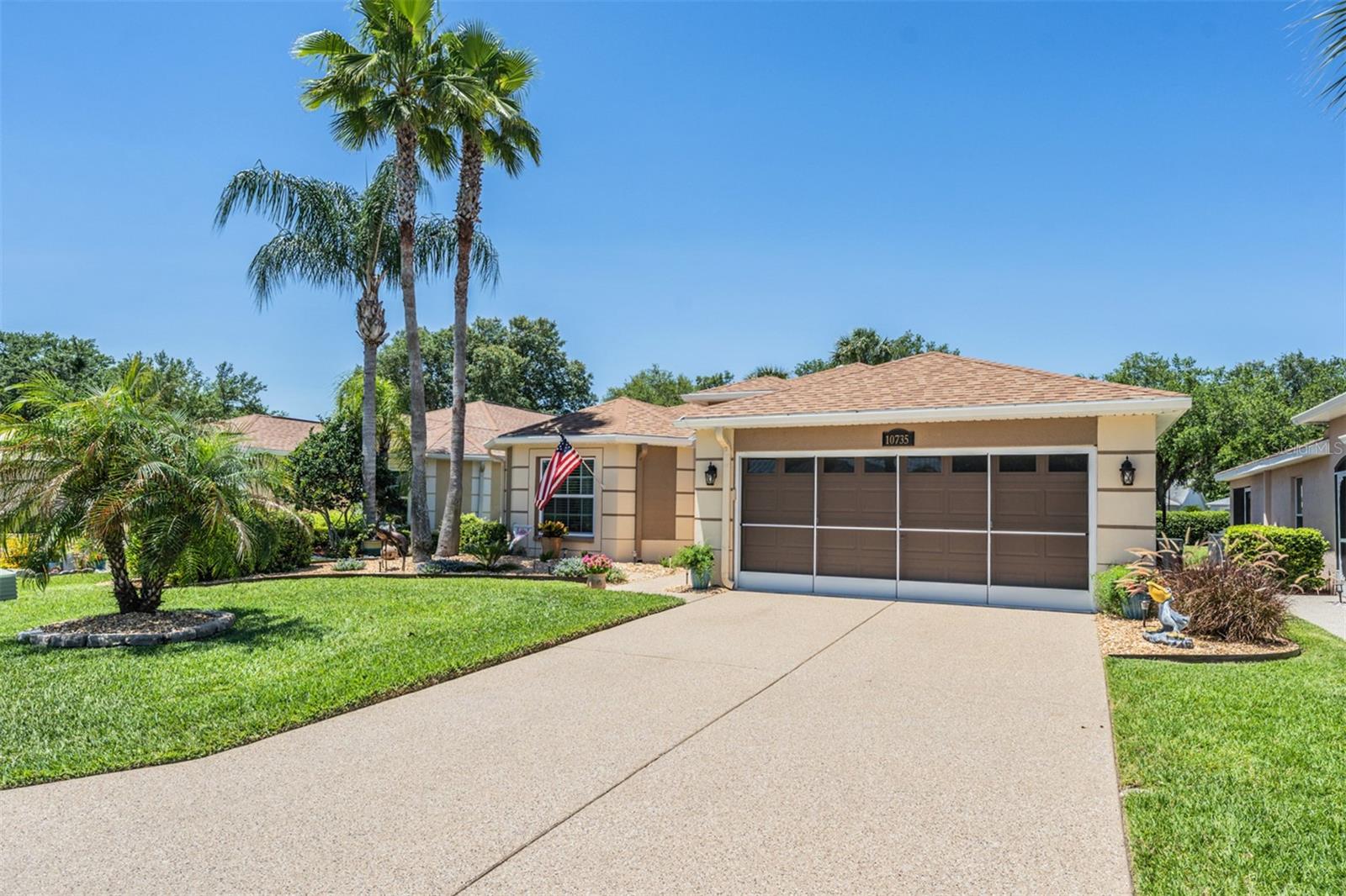 Stunning driveway and screened 2 car garage on this impeccable home~