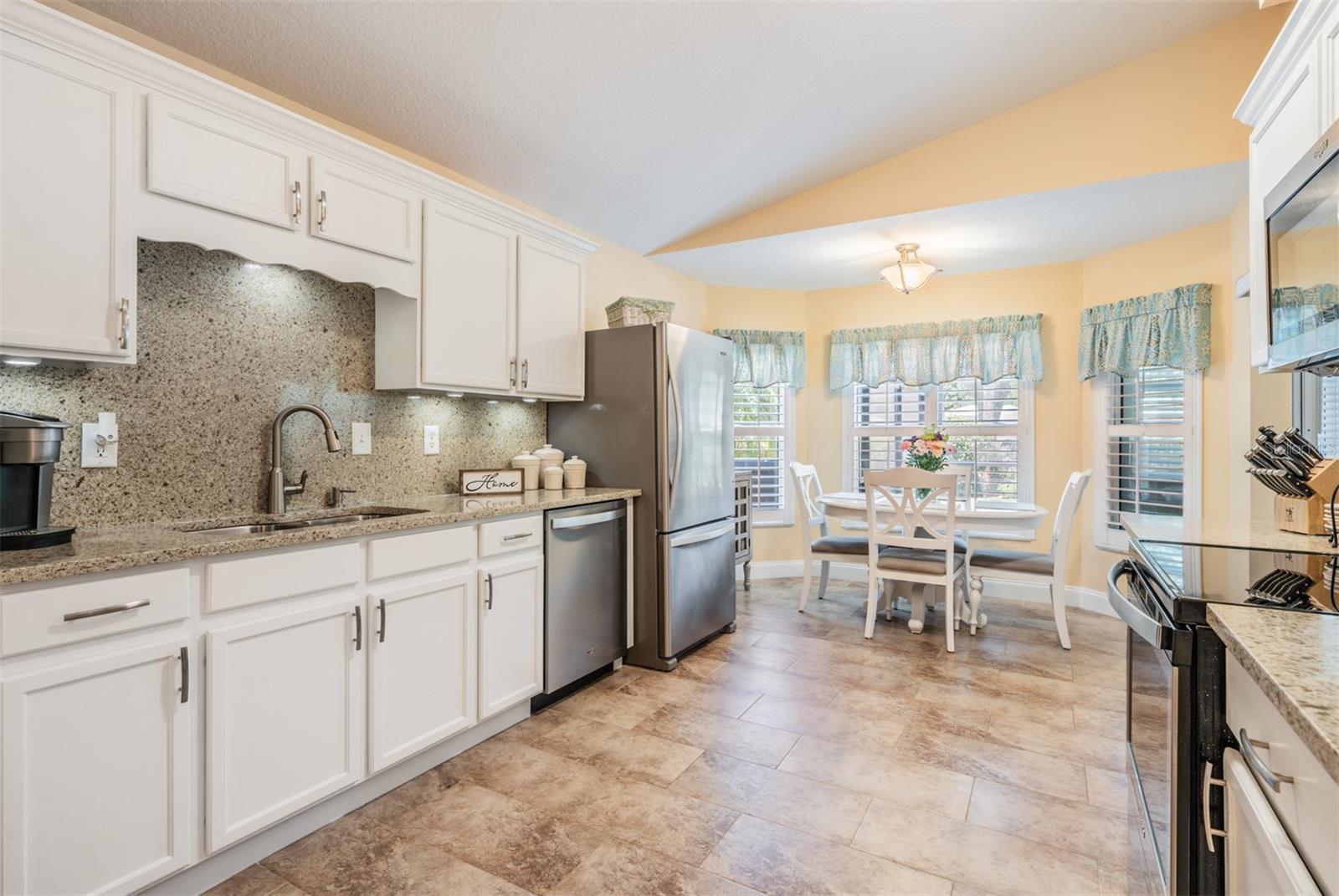 Sleek kitchen with eat in breakfast nook