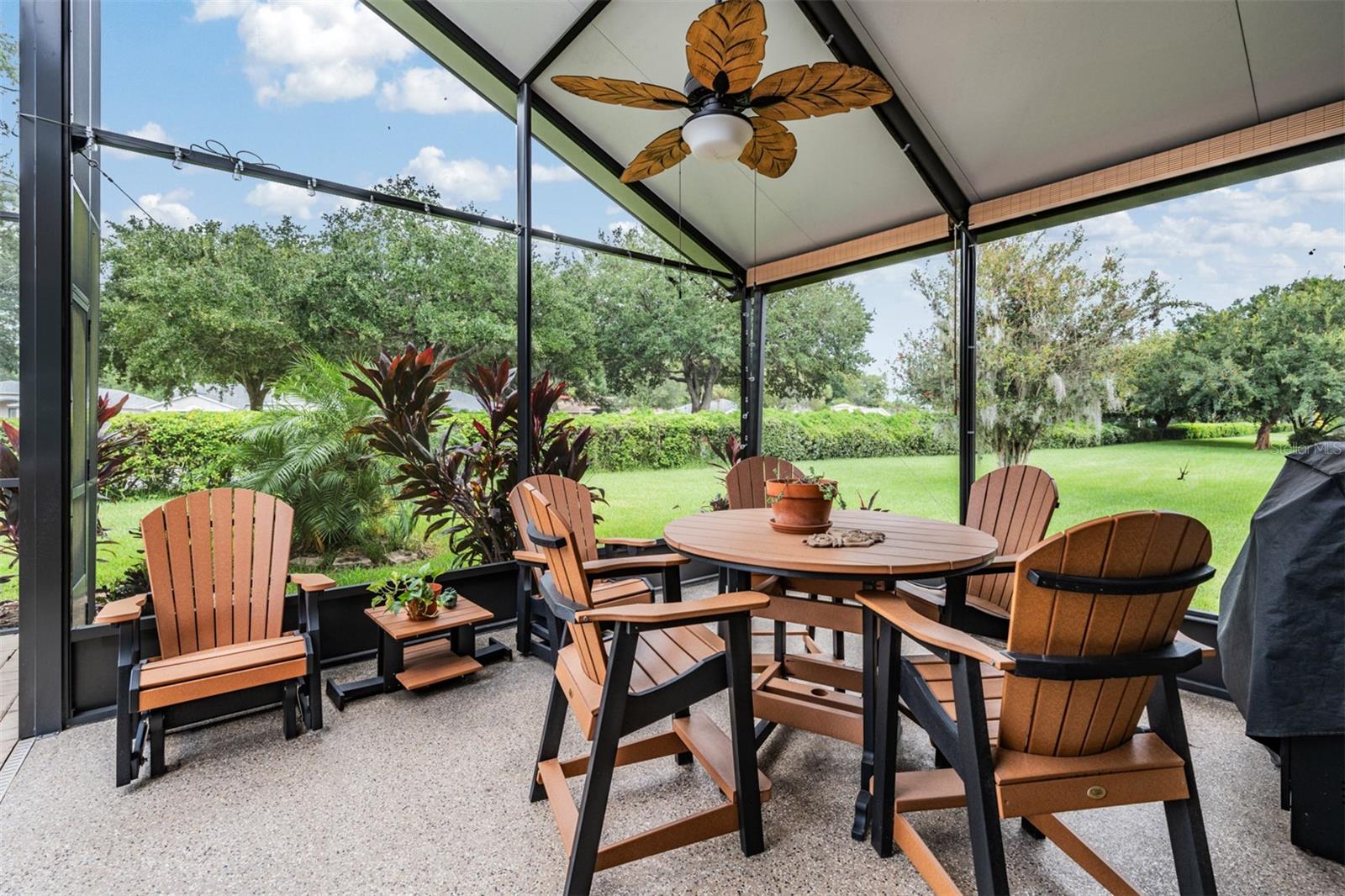 Extended screened lanai with insulated roof to enjoy outdoor living even in the rain!