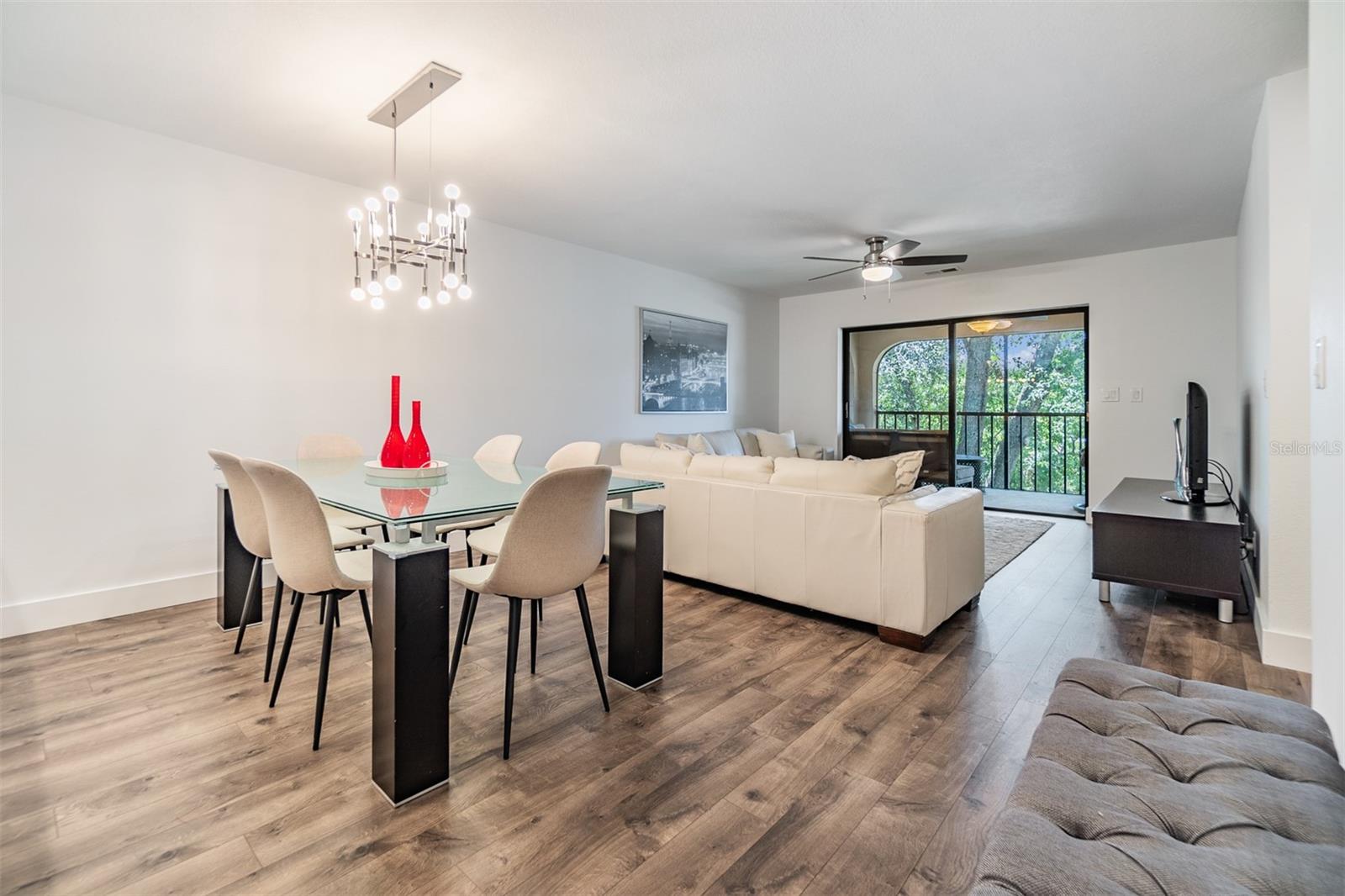 Dining/Living area with sliding door leading to the screened porch.