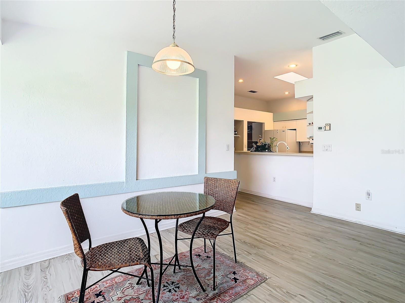 Dining area with kitchen view.