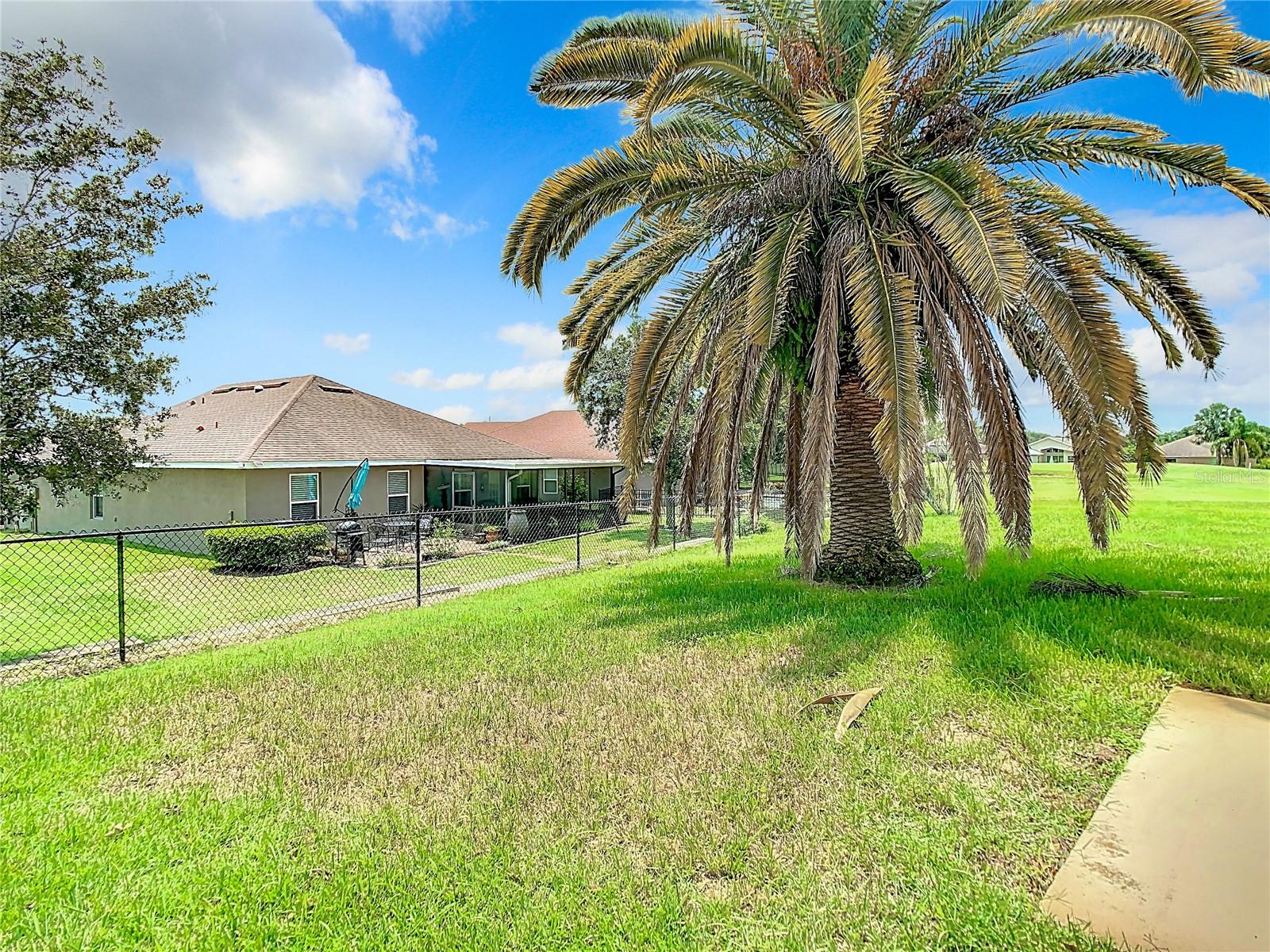 Back yard area . Homes on the other side of the fence is the Reserve Community which is also a part of Meadow Oaks.