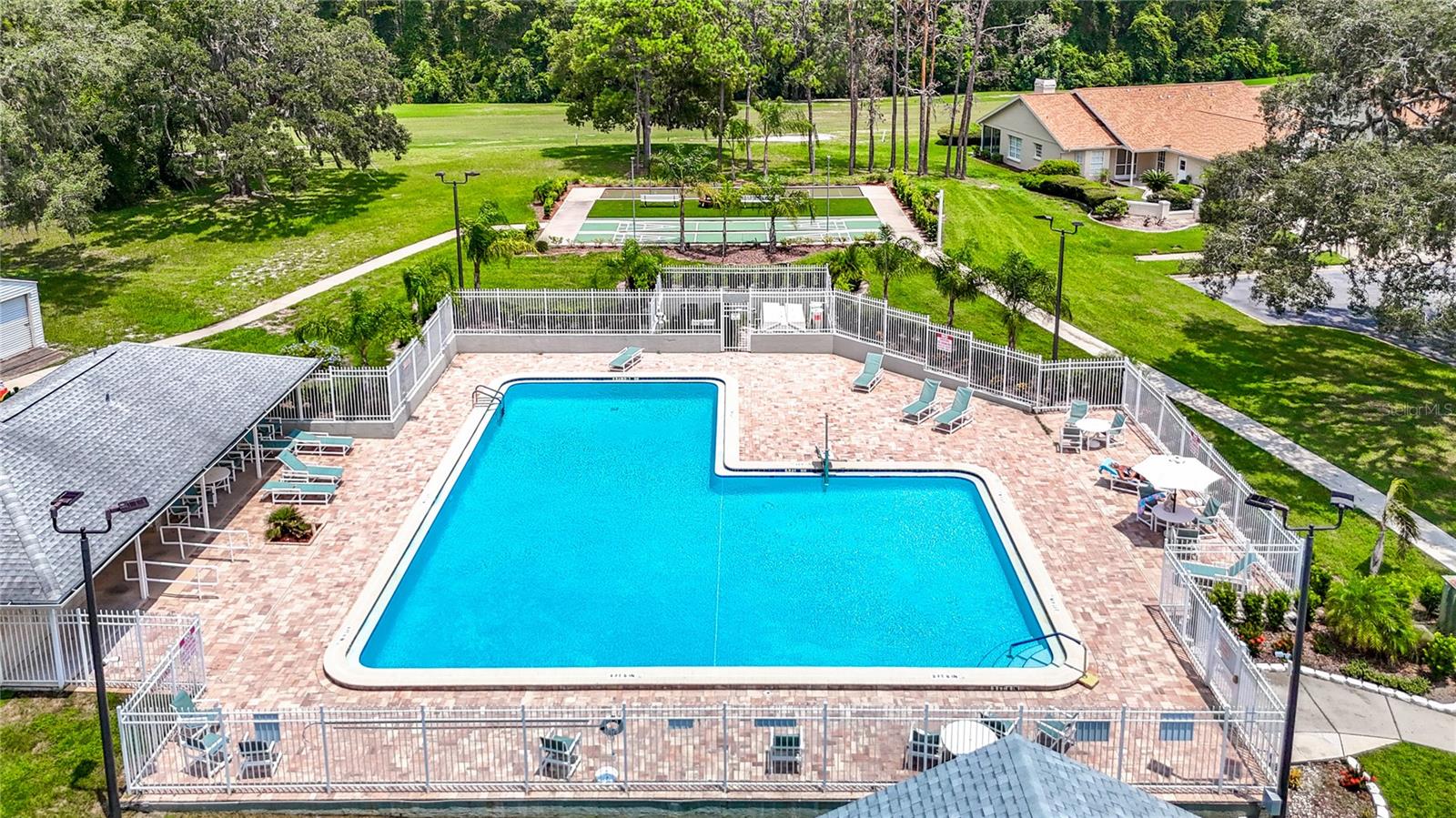 The swimming pool is a good size and has pavers. The cabana room has bathrooms and an outdoor shower. A great place to cool off on those hot days. Come on out and play pool volley ball if you are interested.