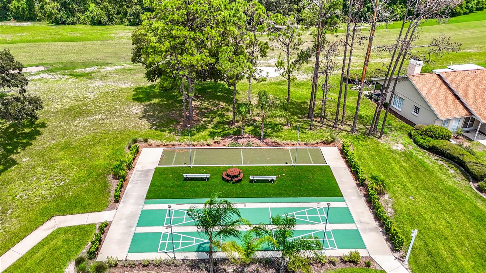 Shuffleboard / Bocce Ball area with small area to be a spectator or just enjoy the outside world.