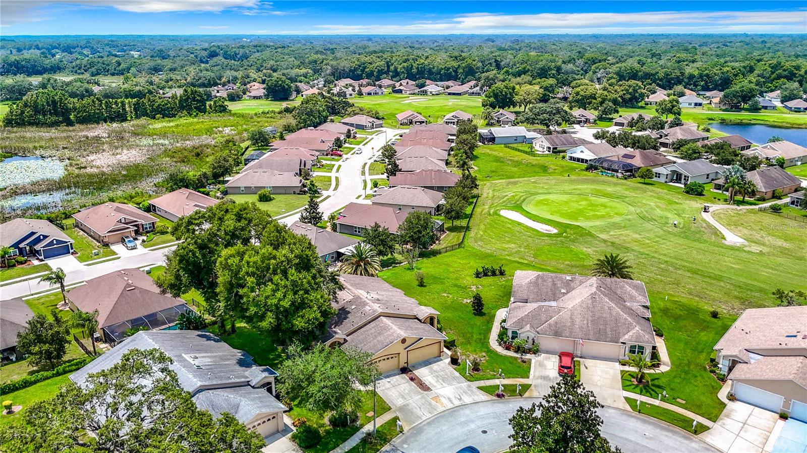 Overhead view of property at bottom middle part of the picture. Property has a view of the 14th green area.