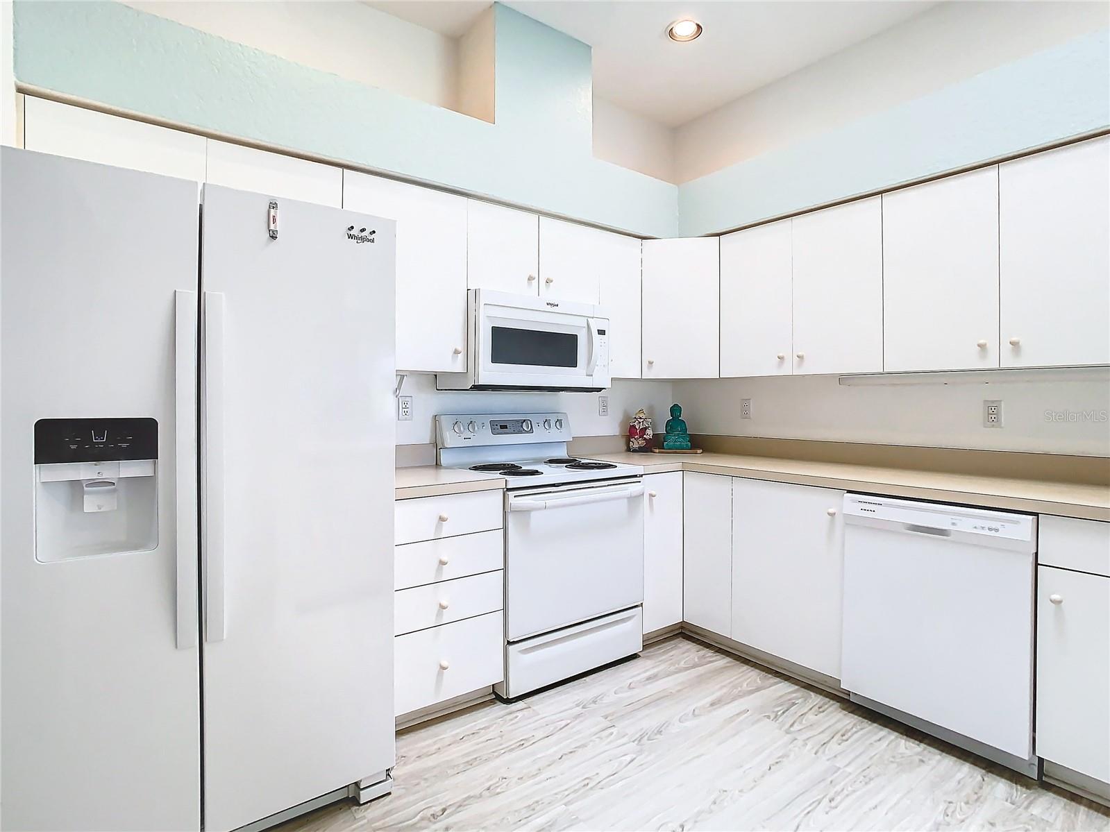 Plenty of cabinet, drawer space along with counter space make this kitchen a great work space.