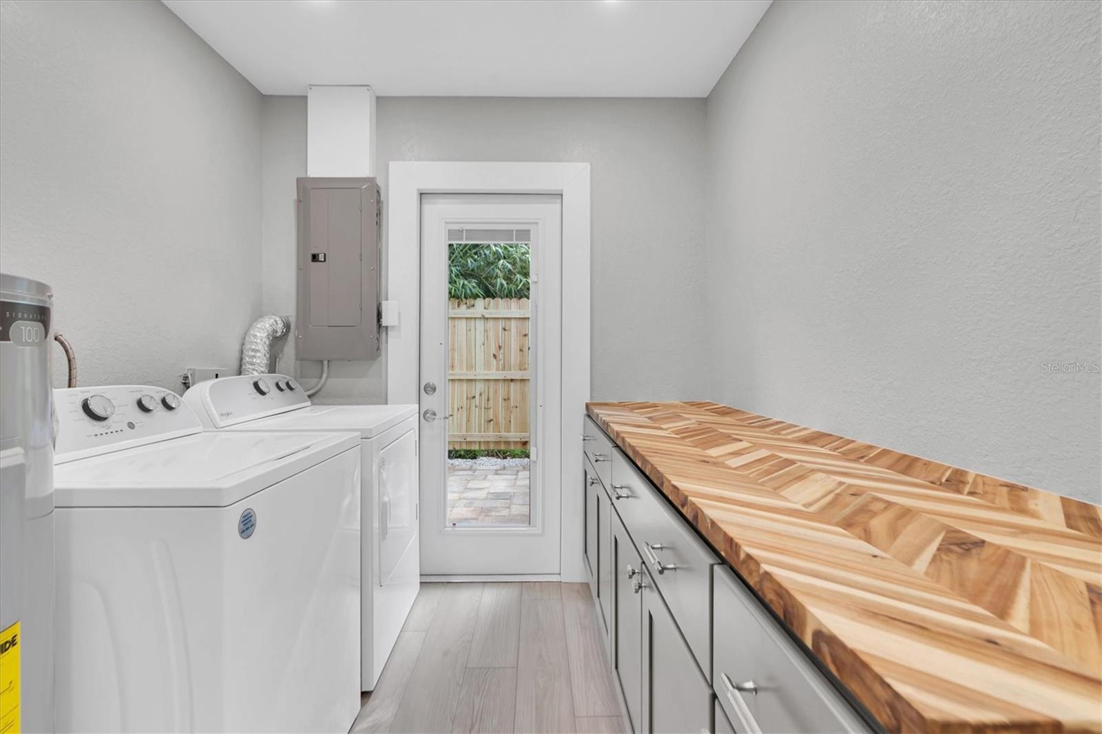 Inside laundry room with butcher block counter