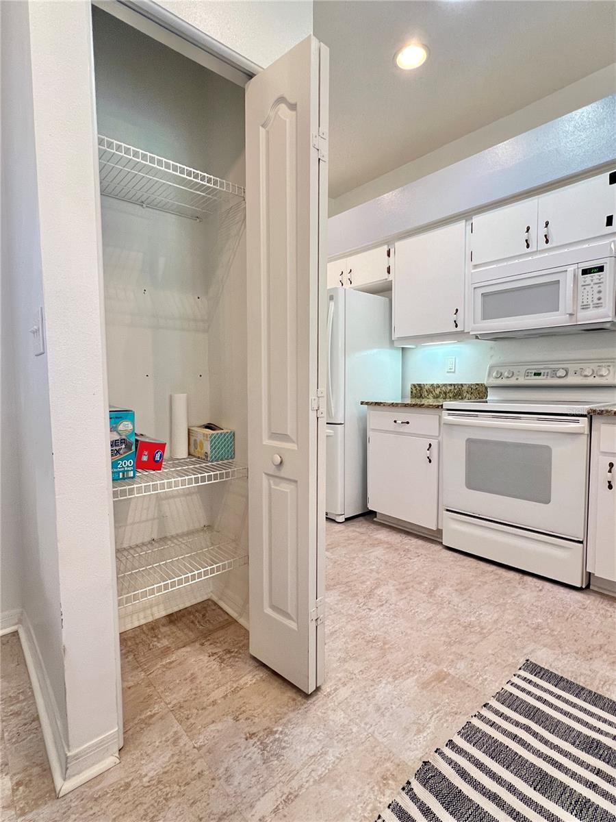 There are TWO pantries, and this one could be transformed into a coat closet.