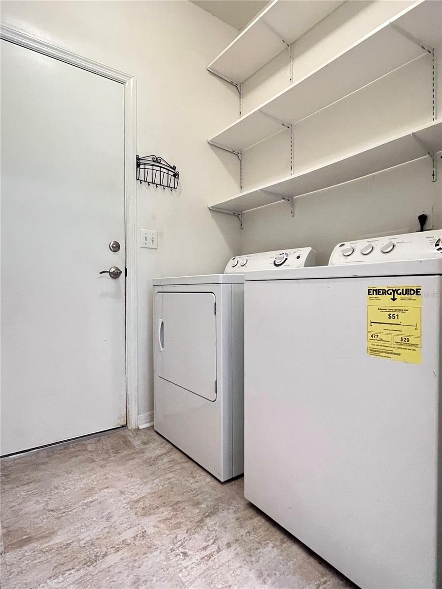 The laundry room is off the kitchen and leads to the garage.