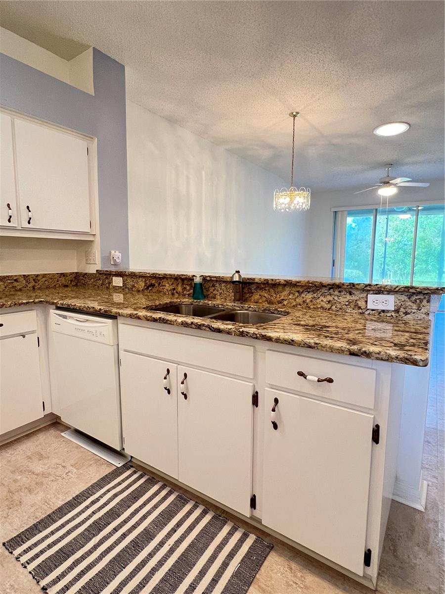 The kitchen has a breakfast bar that overlooks the great room!