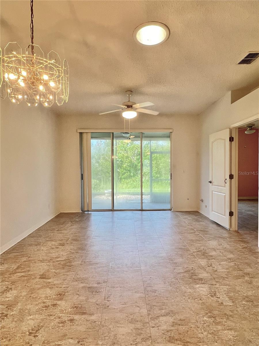 The triple-pocket sliding glass door leads to the screened-in patio.  Enjoy cool nights without bugs!