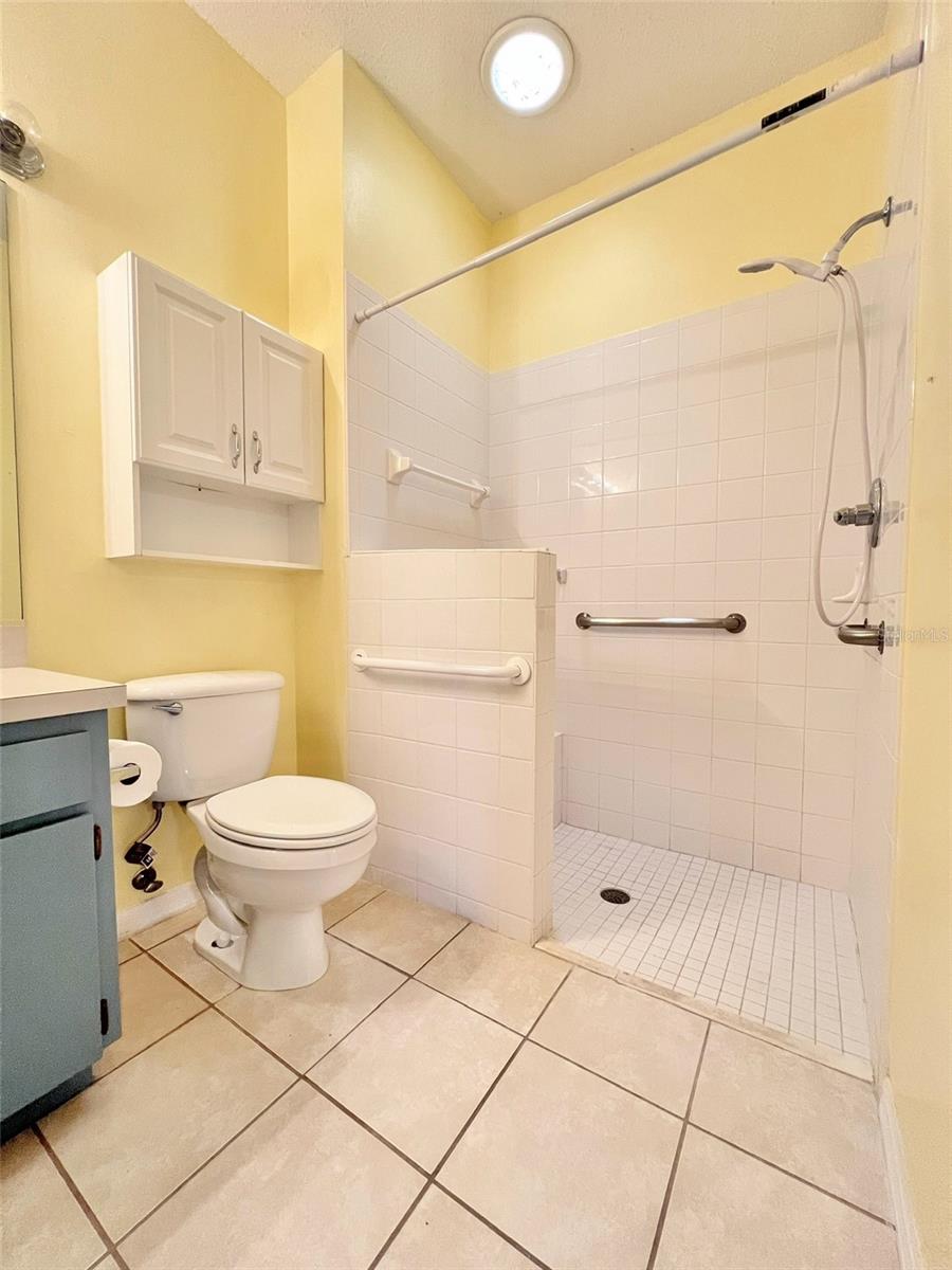 The primary bathroom is spacious and has a roll-in shower if needed. Grip handles make life easy too!