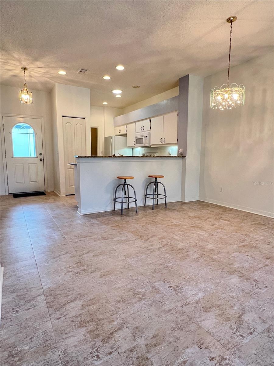 Inside, you'll enjoy your beautiful kitchen with updated granite countertops, recessed lighting, and a breakfast bar that looks out to the great room.