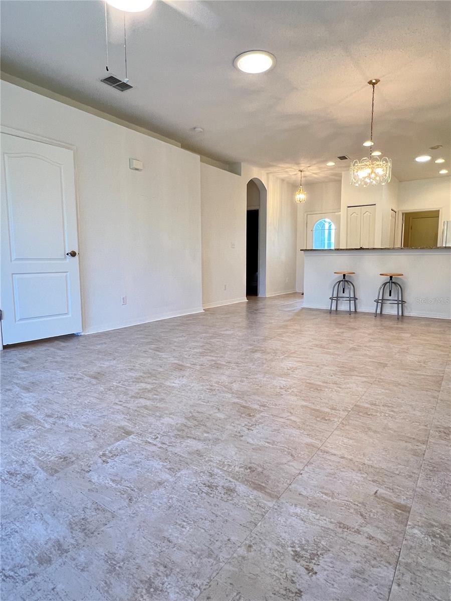 The great room and kitchen have beautiful, updated tile flooring, and there's an extra box in the garage.