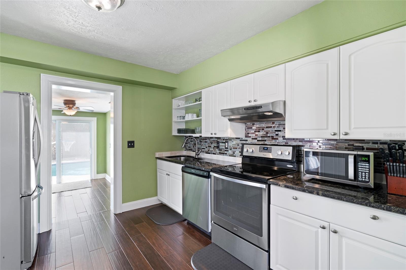 Kitchen open to Bonus Room