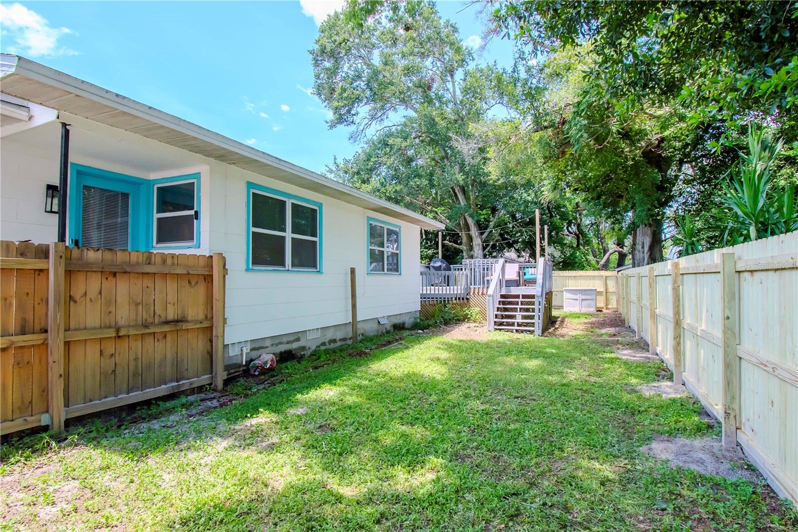 Side yard with brand new fence.