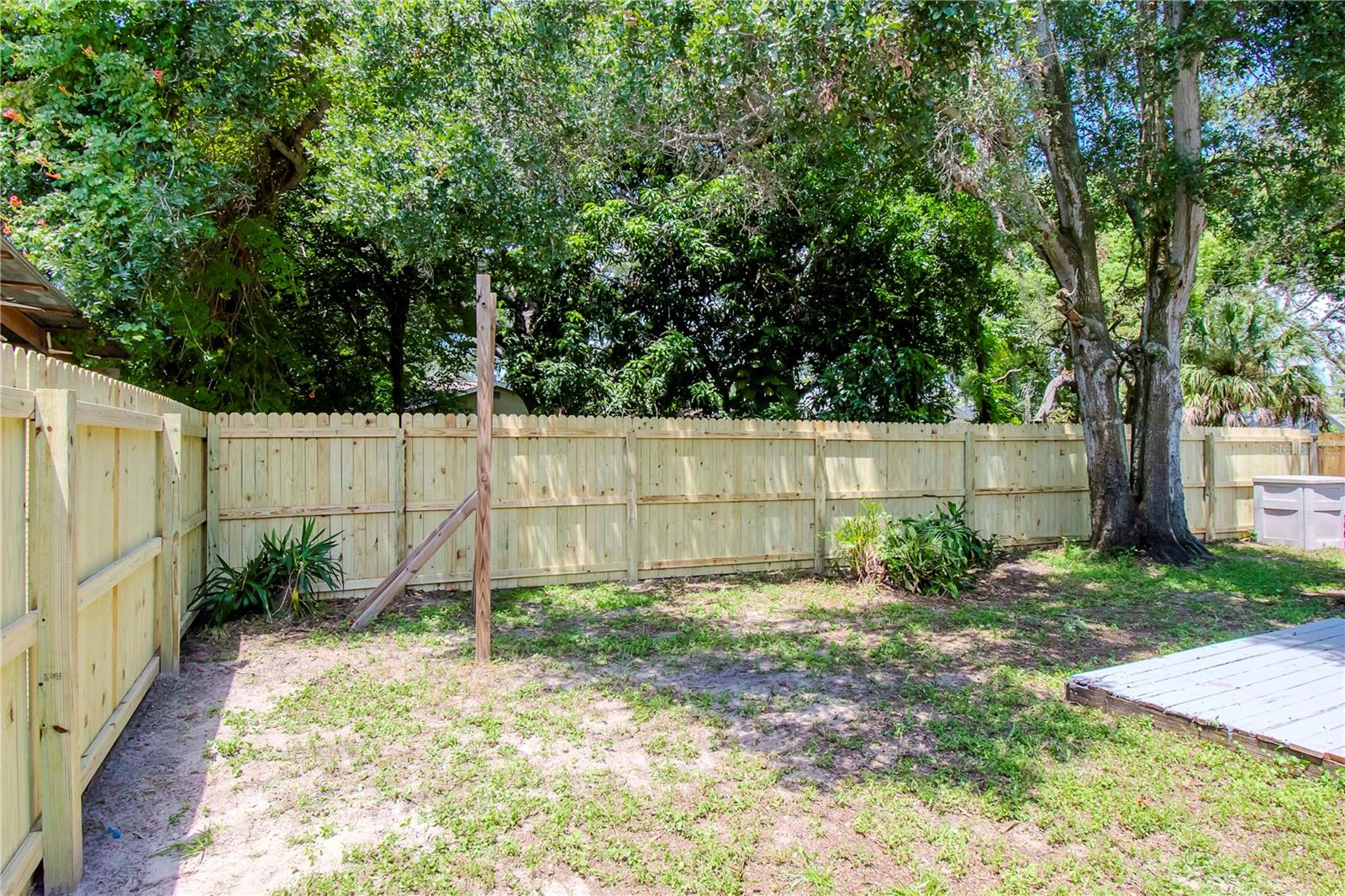 Another angle of the back yard and new fence.