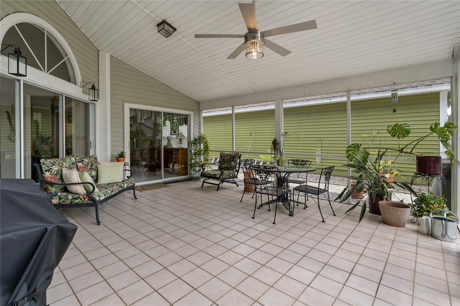 Tiled, Covered, Screened Lanai with overhead lighted Ceiling Fan