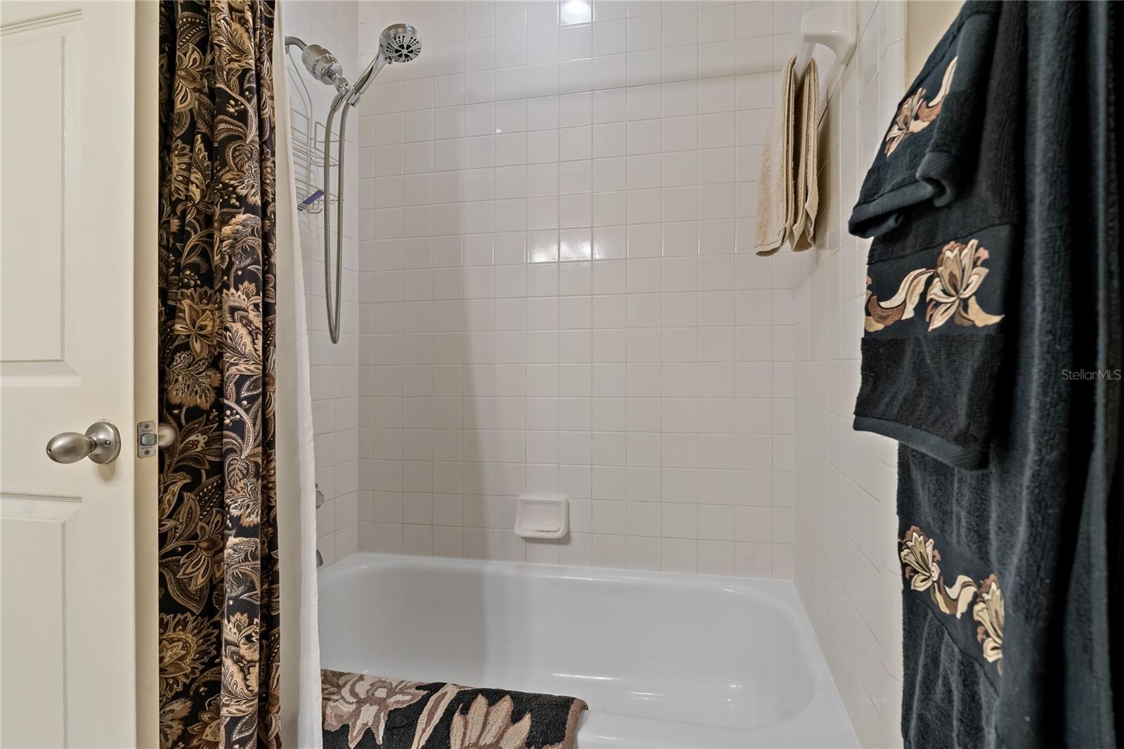 Guest Bathroom with Tile Floor and Tub/Shower