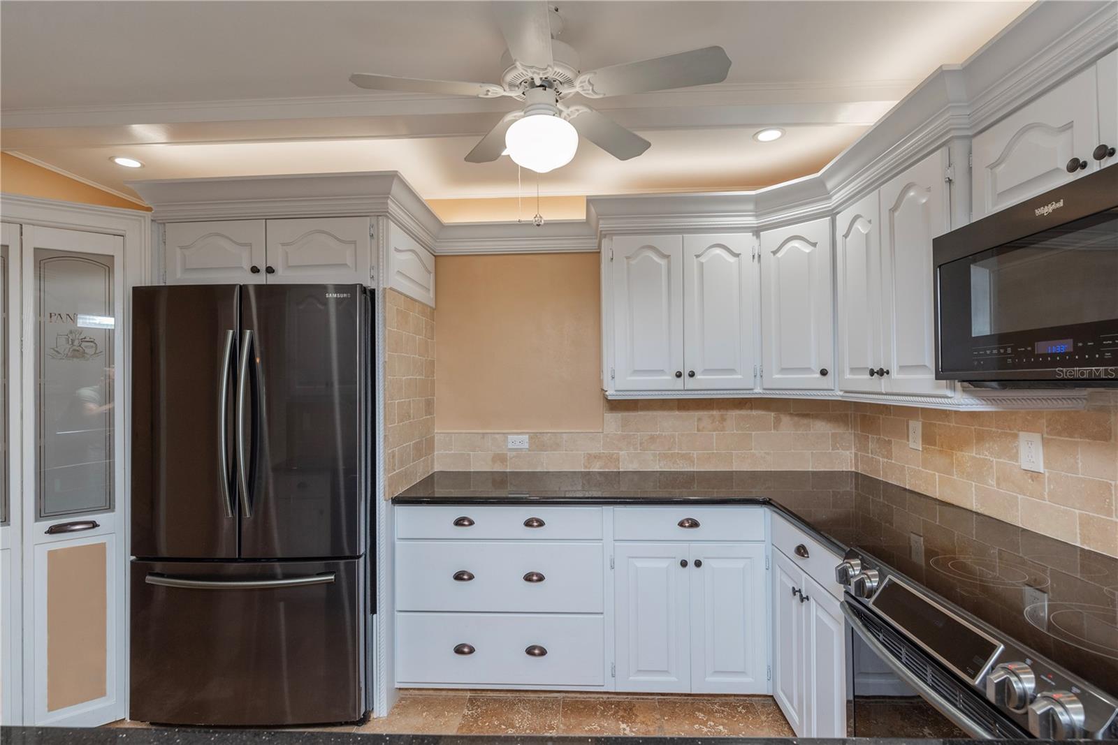 Kitchen with walk-in pantry.