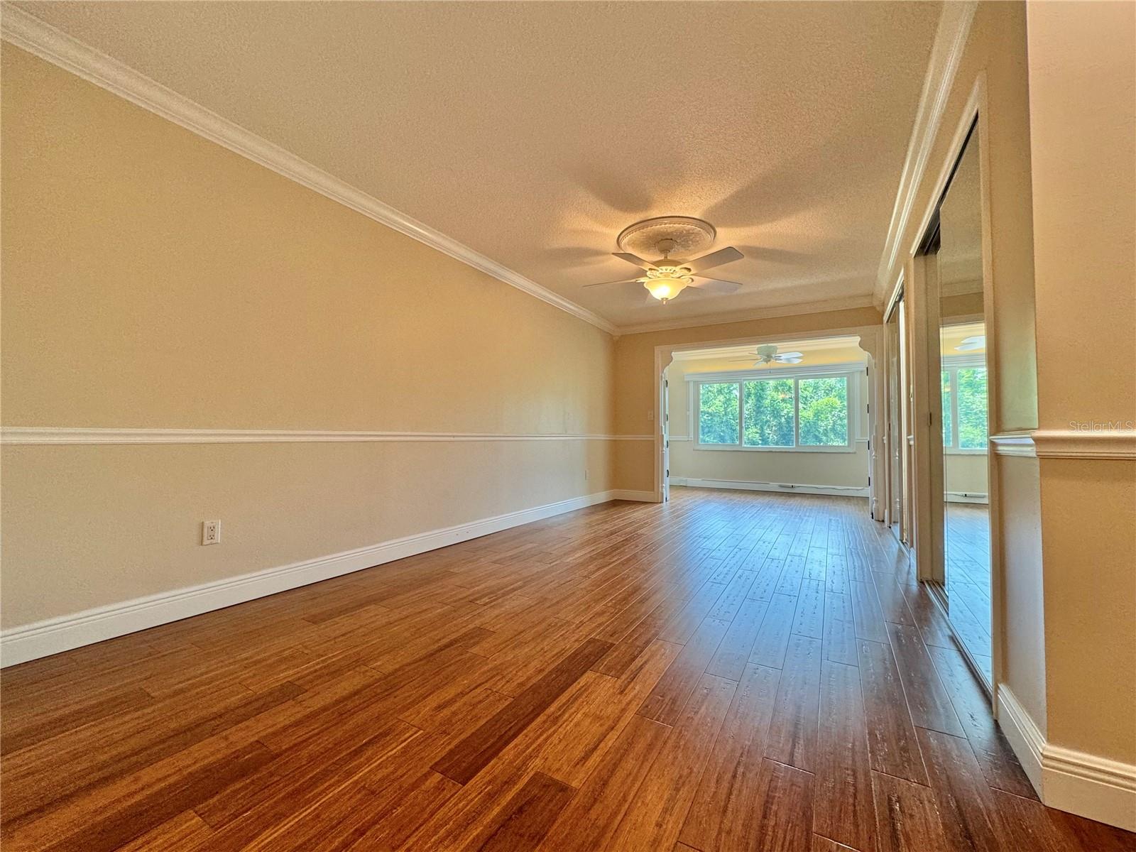 Primary bedroom, barn doors open to sitting room.