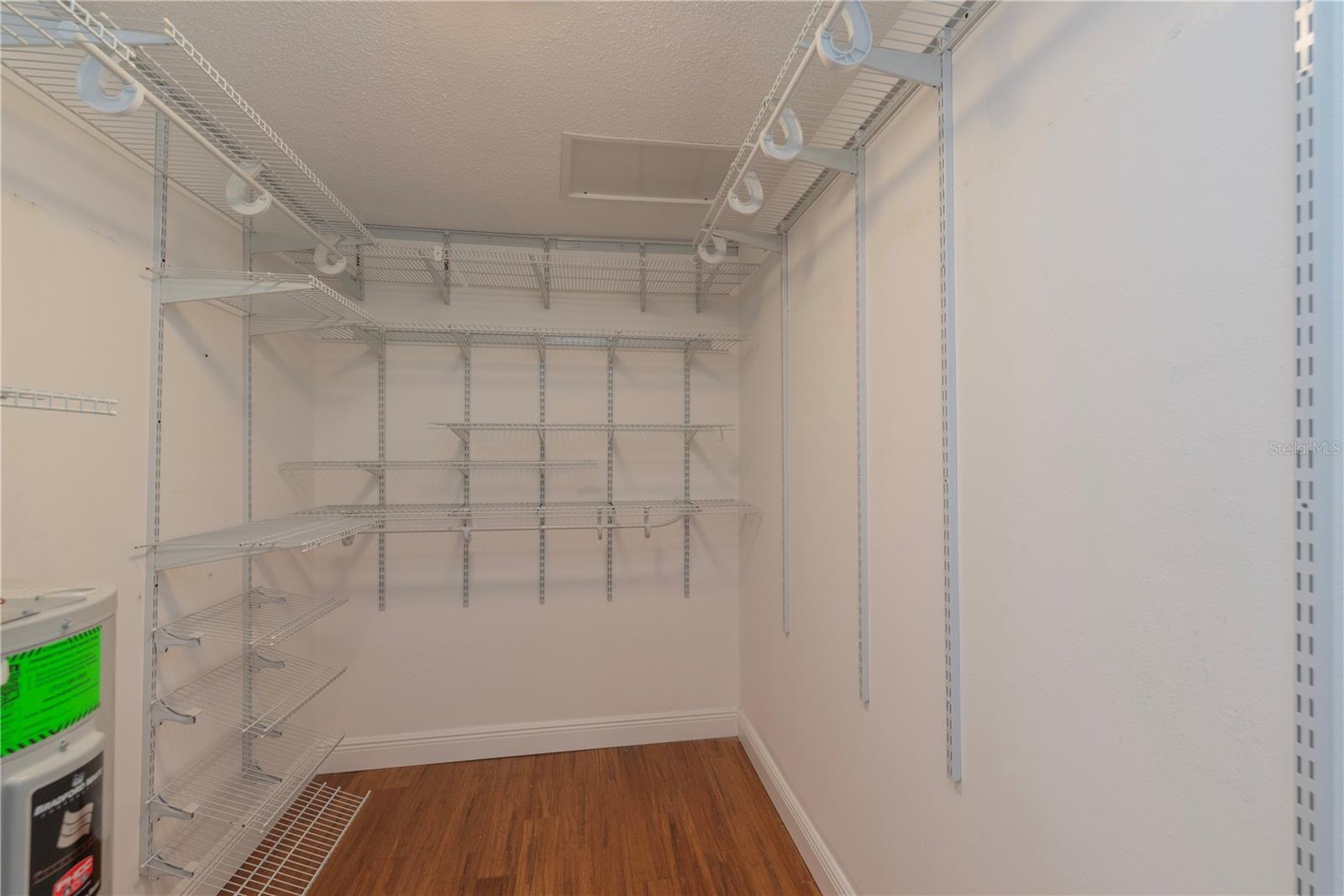 Primary bedroom walk-in closet.