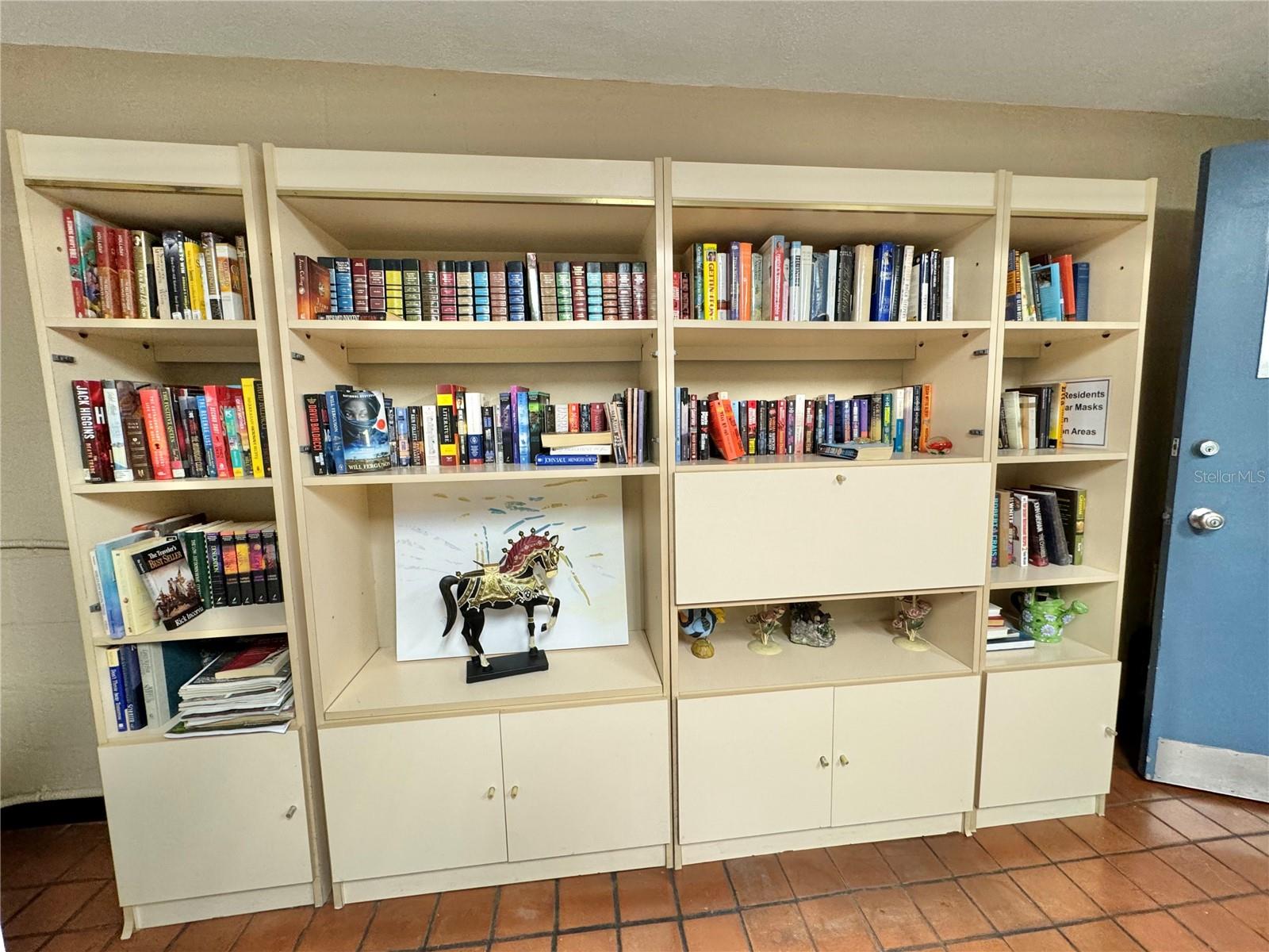 Library in community laundry room.