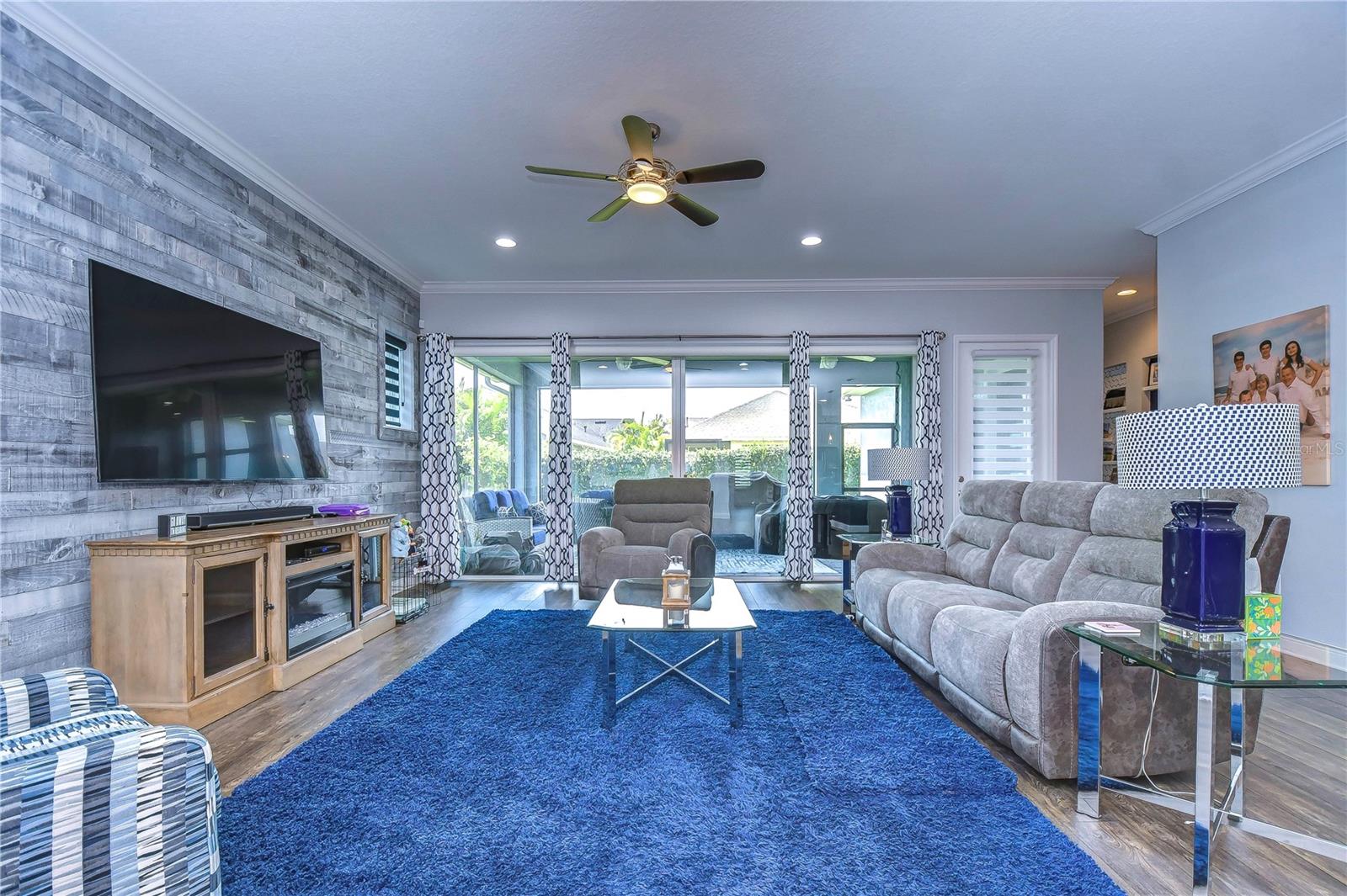 Family room with accent wall and French sliders to lanai !