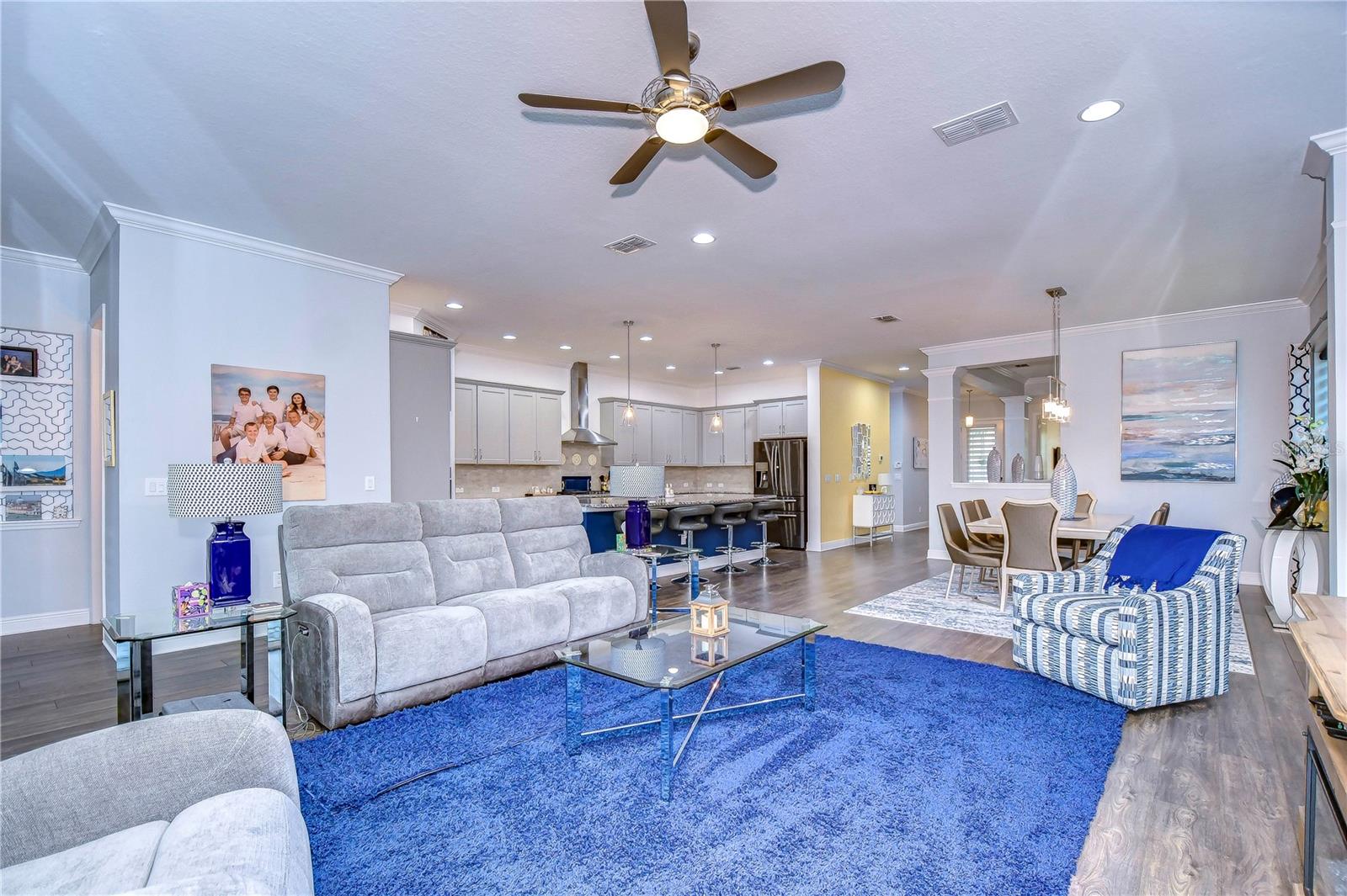 The great room opens up to the kitchen and formal dining area!