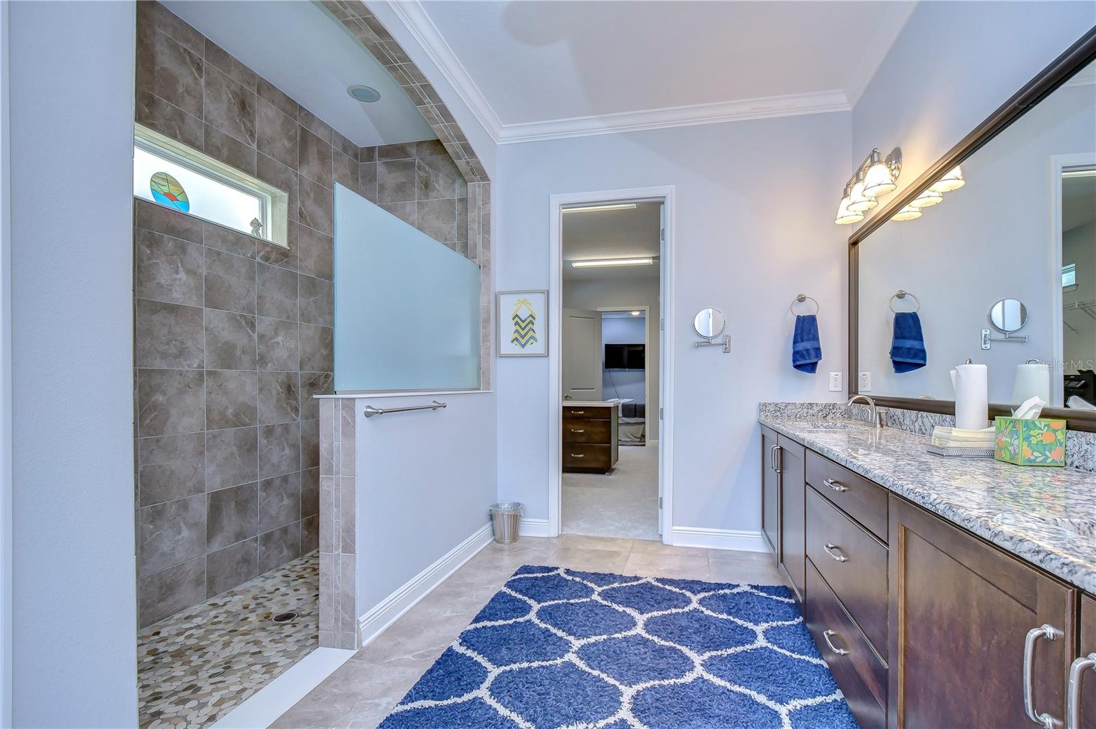 En-suite bathroom features dual sinks and lengthy walk-in shower!