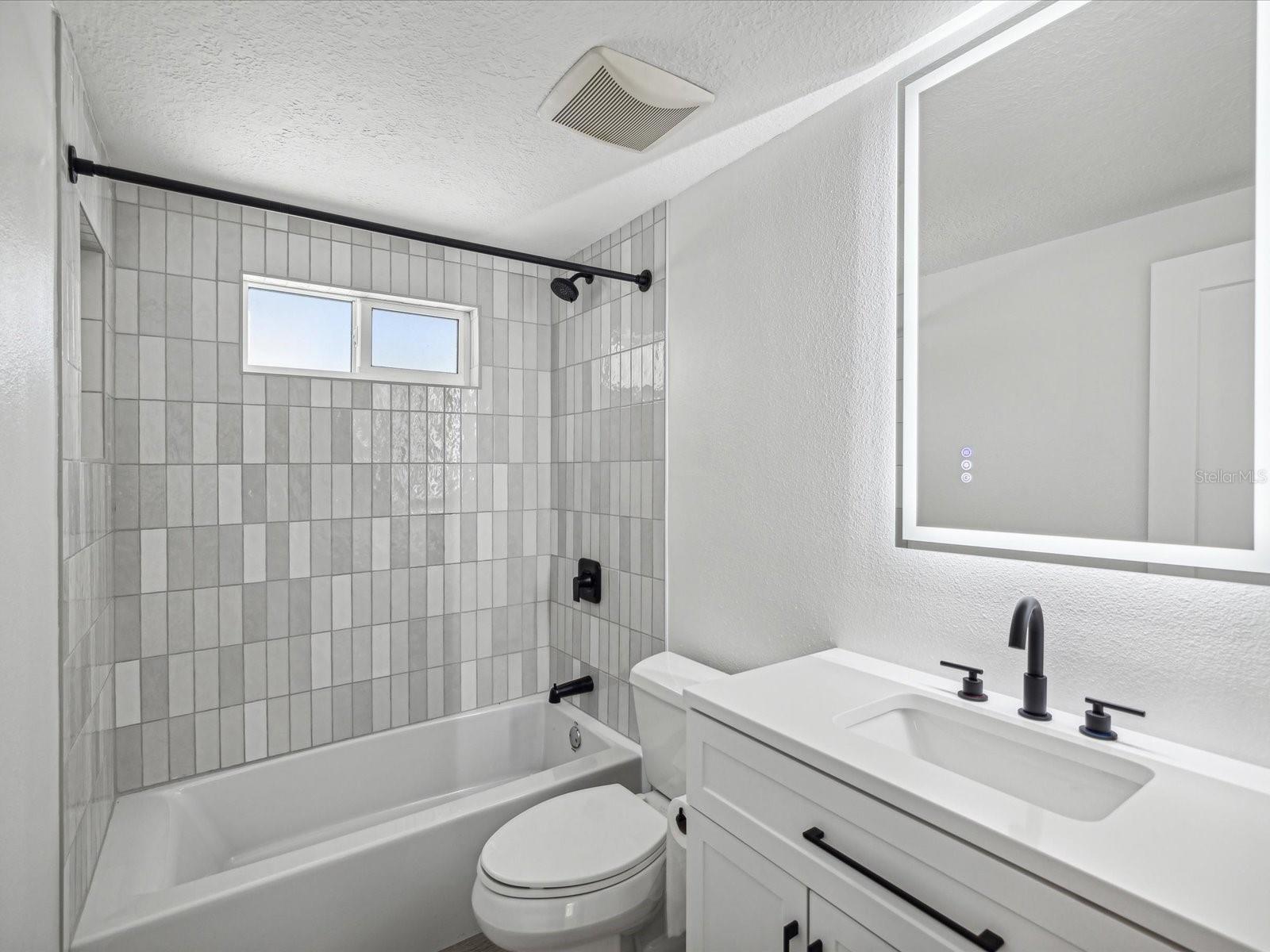 Hall Bath with lighted Vanity Mirror