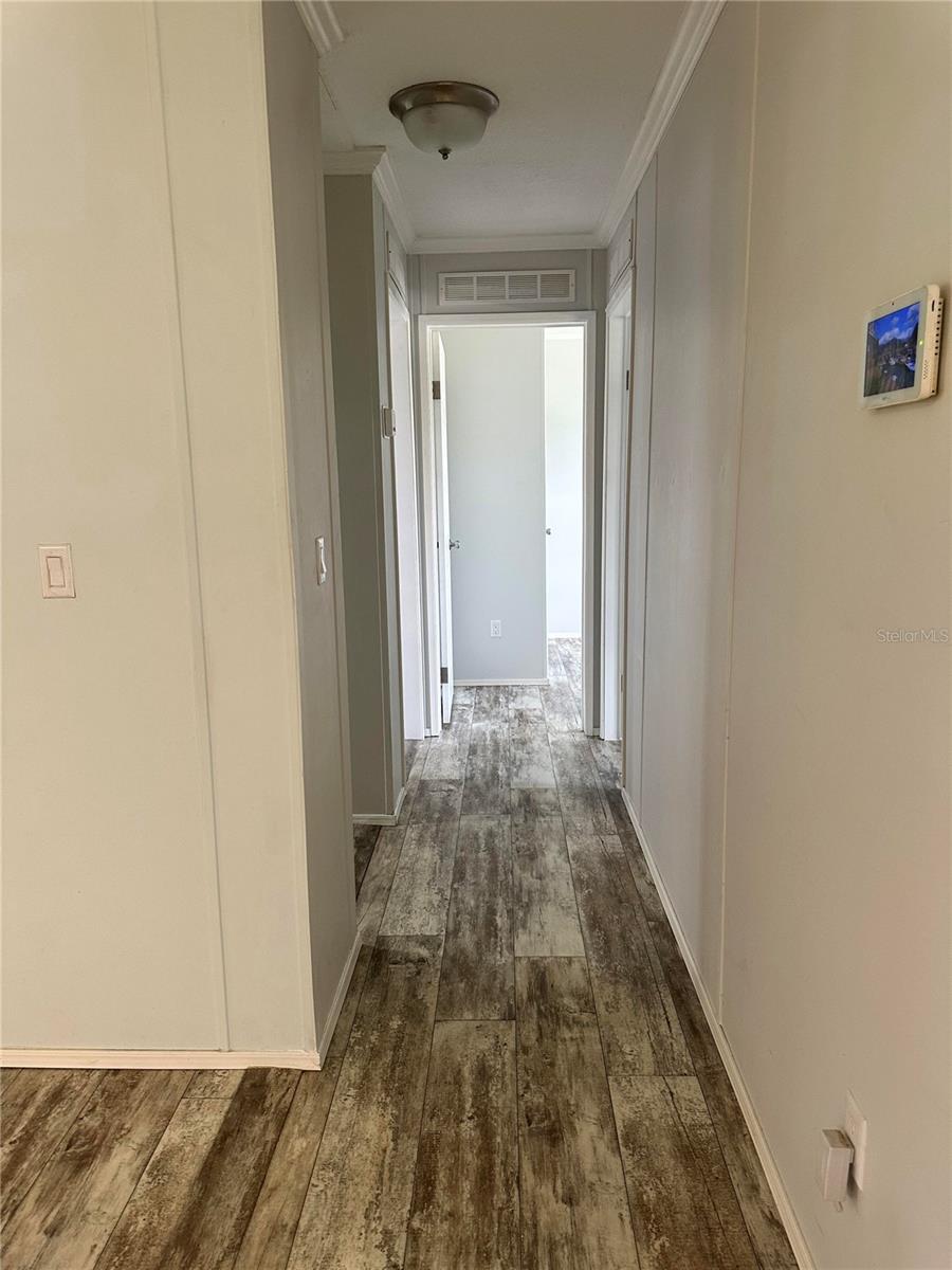 Hallway to bedrooms and guest bathroom from living room