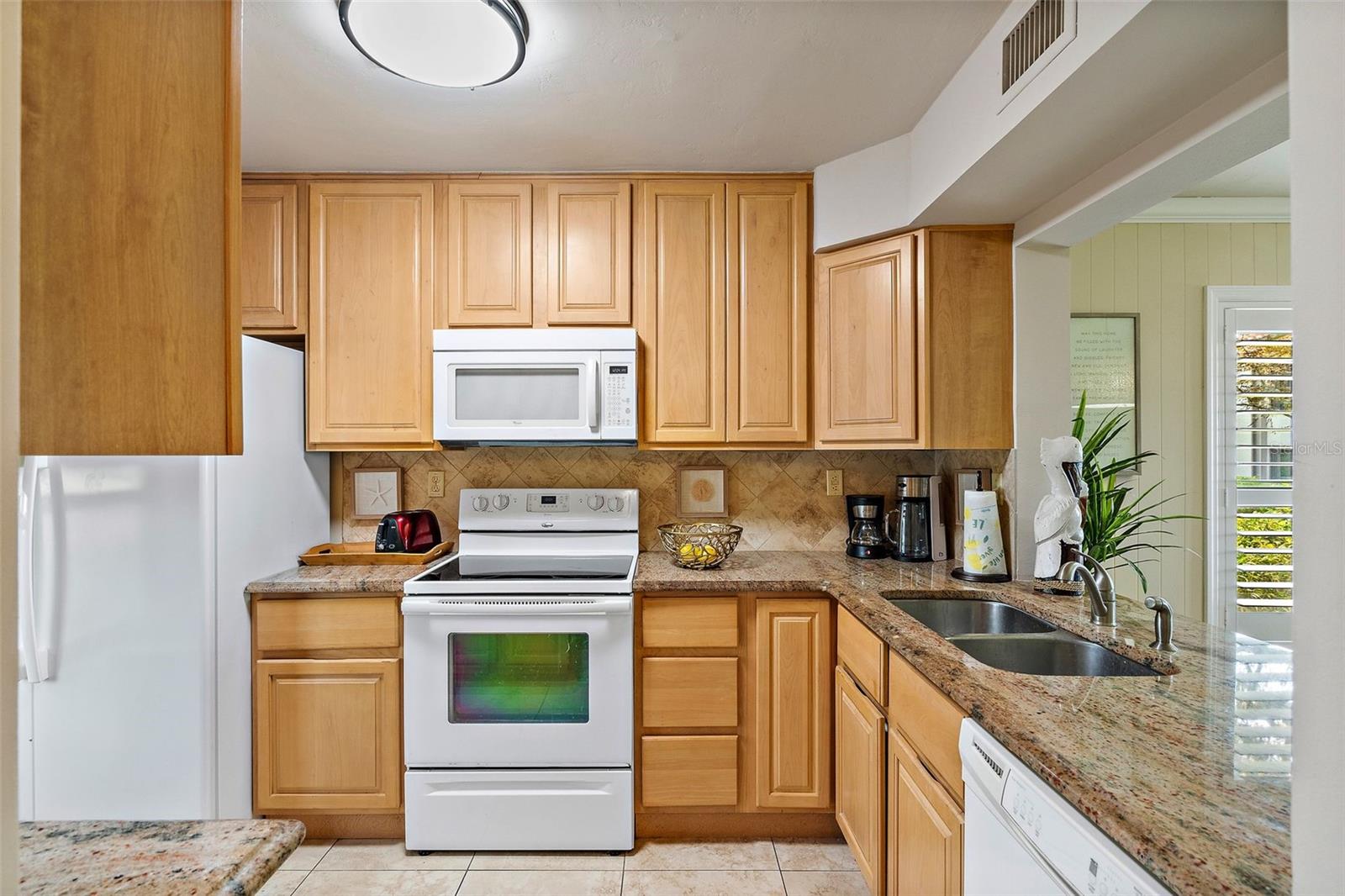 Granite Countertops and solid wood cabinets.