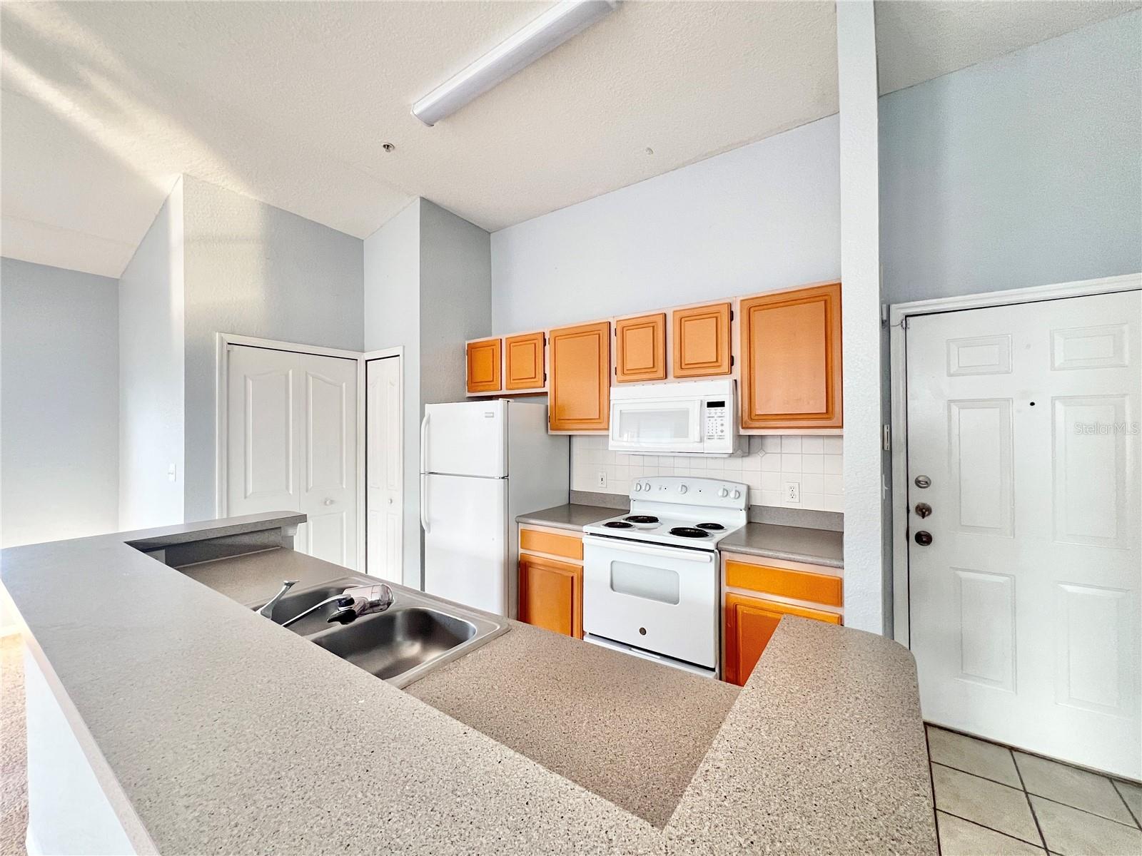 The island features the sink and the dishwasher.