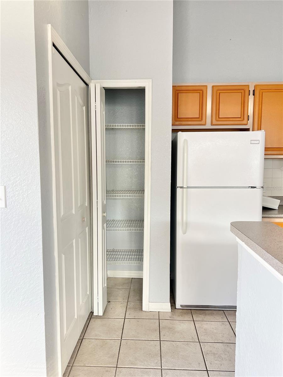 The laundry room is left of the pantry.