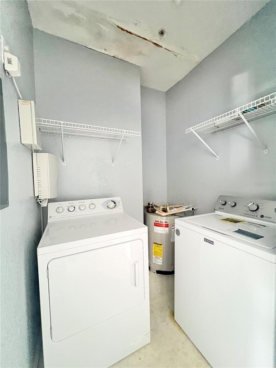 Laundry room and hot water heater.  Washer & dryer are inlcuded.