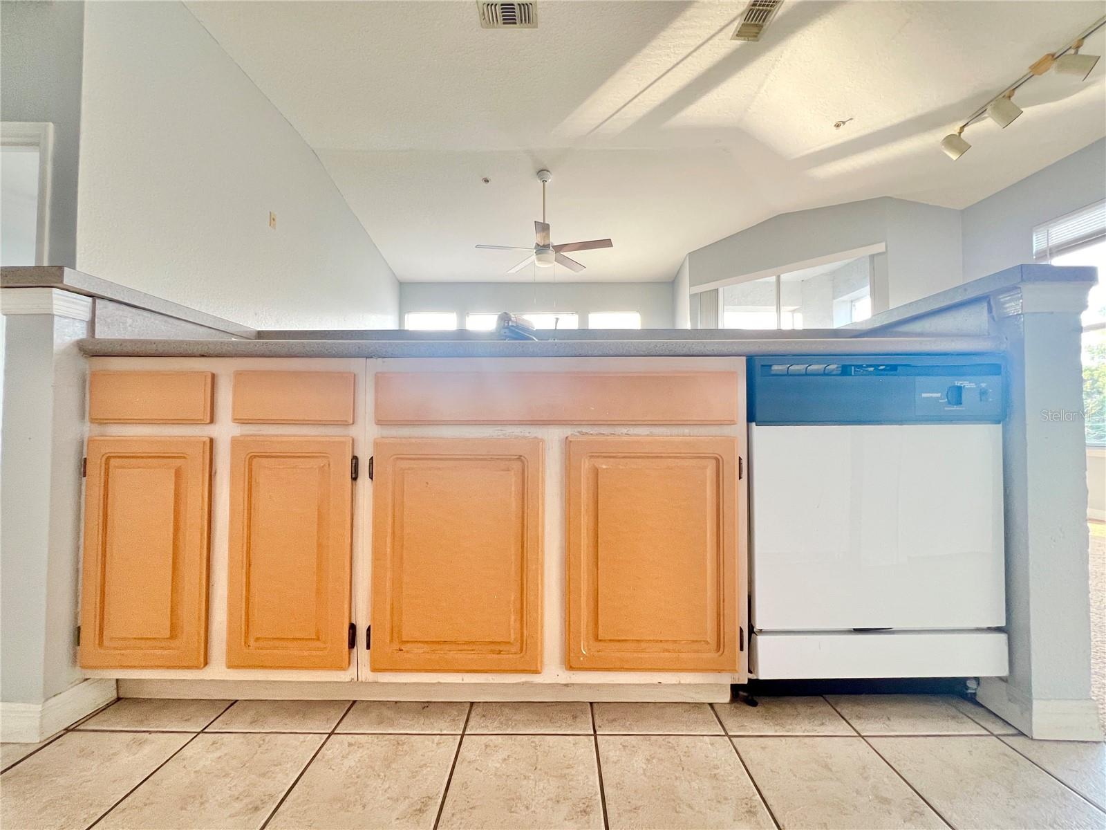 The island features the sink and the dishwasher.