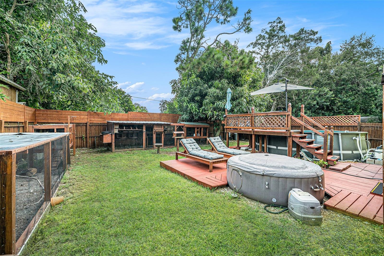 Above-ground saltwater POOL and HOT TUB, completed with a wrap-around DECK.