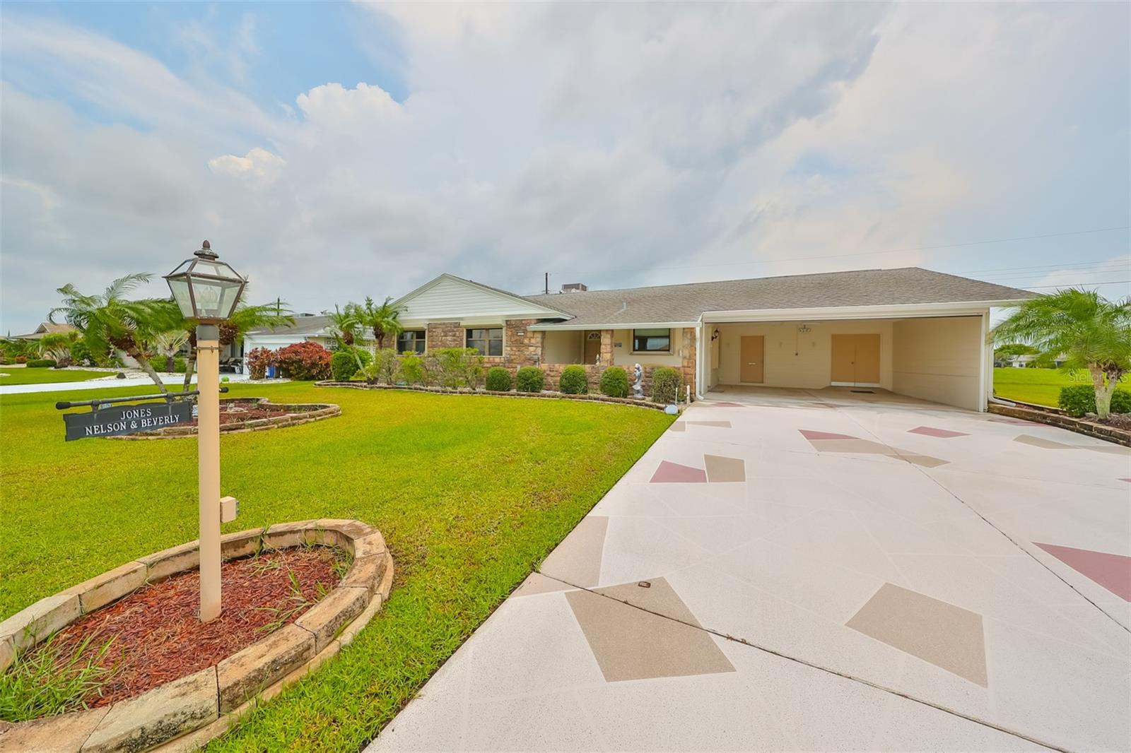 A deep, double wide, customized driveway is perfect for multiple cars.