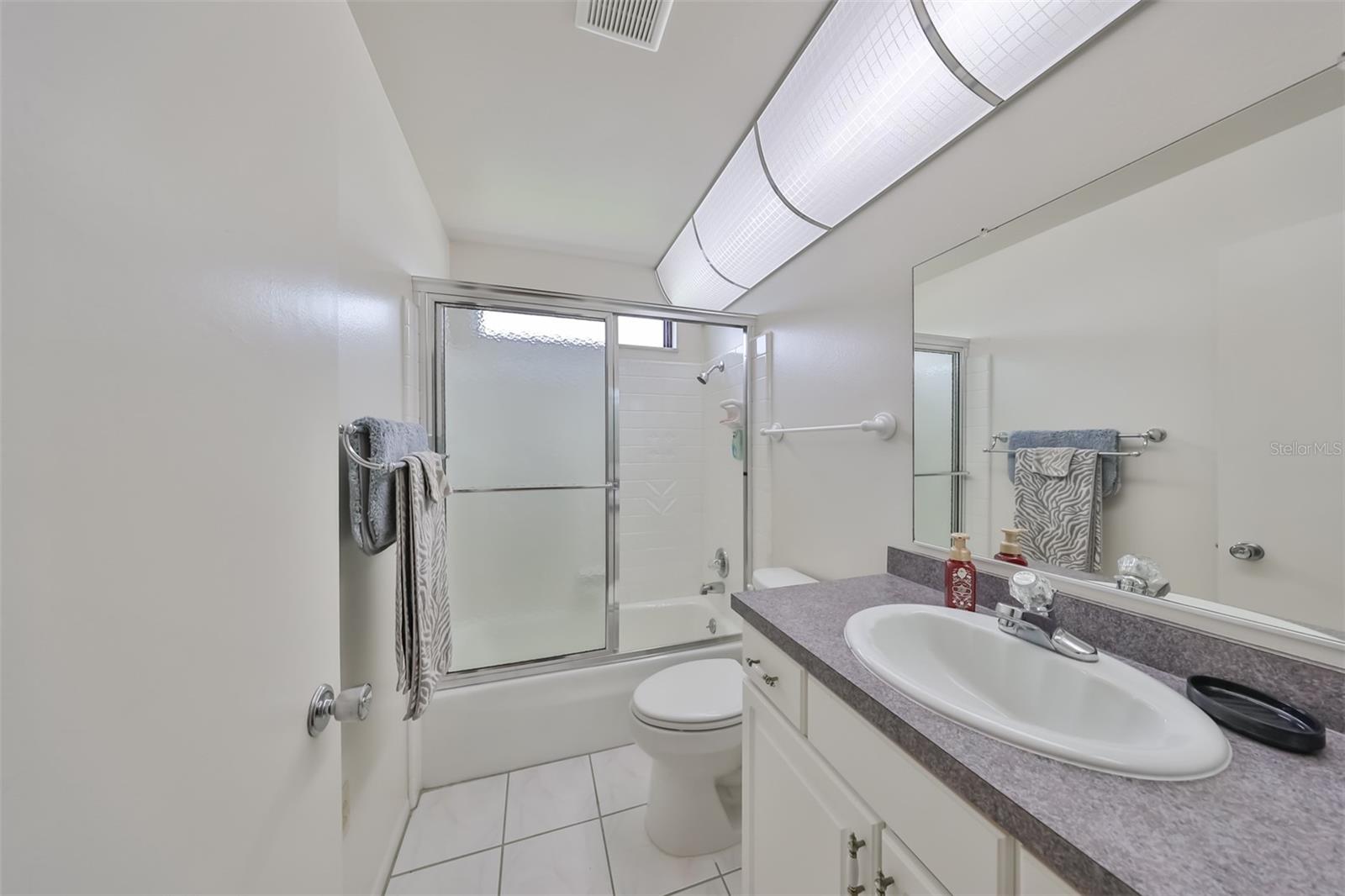 Master bathroom is bright and clean.