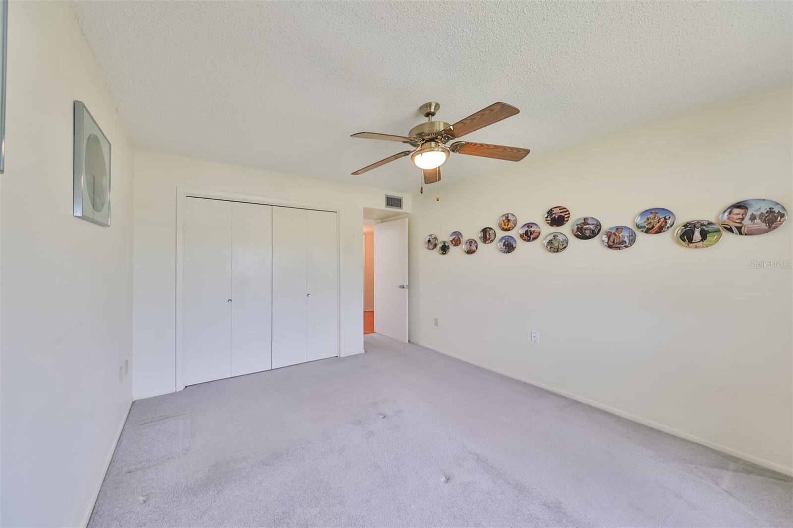 Neutral paint tones and carpet make this a relaxing space.