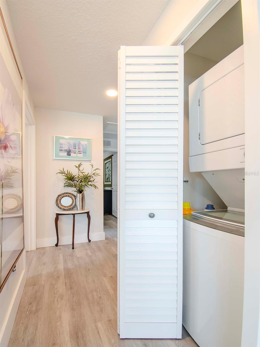 Washer / Dryer closet on your right as you walk down the hall.