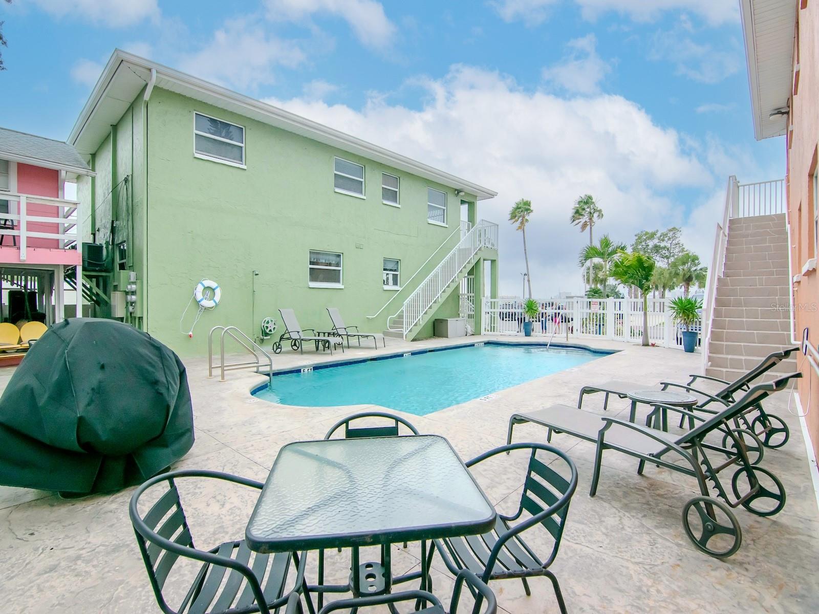 POOL AREA INCLUDES USE OF GAS GRILL, LOUNGE CHAIRS AND TABLES AND CHAIRS.