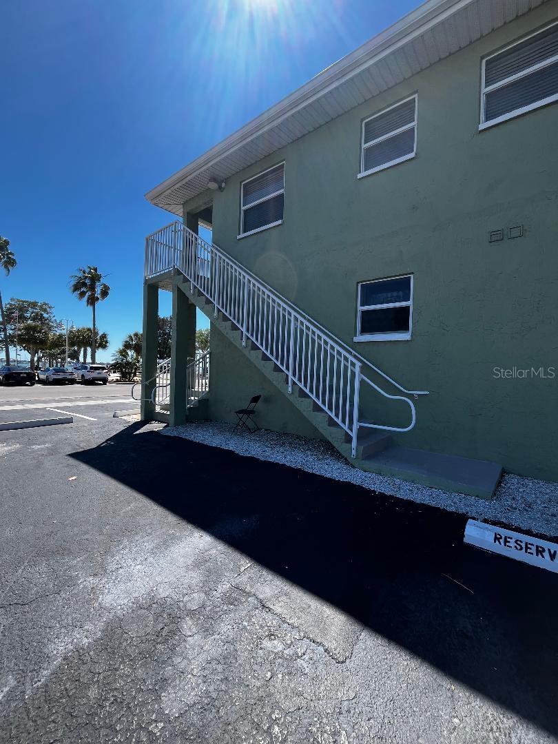 Stairway to 2nd floor/Additional Guest Parking on side